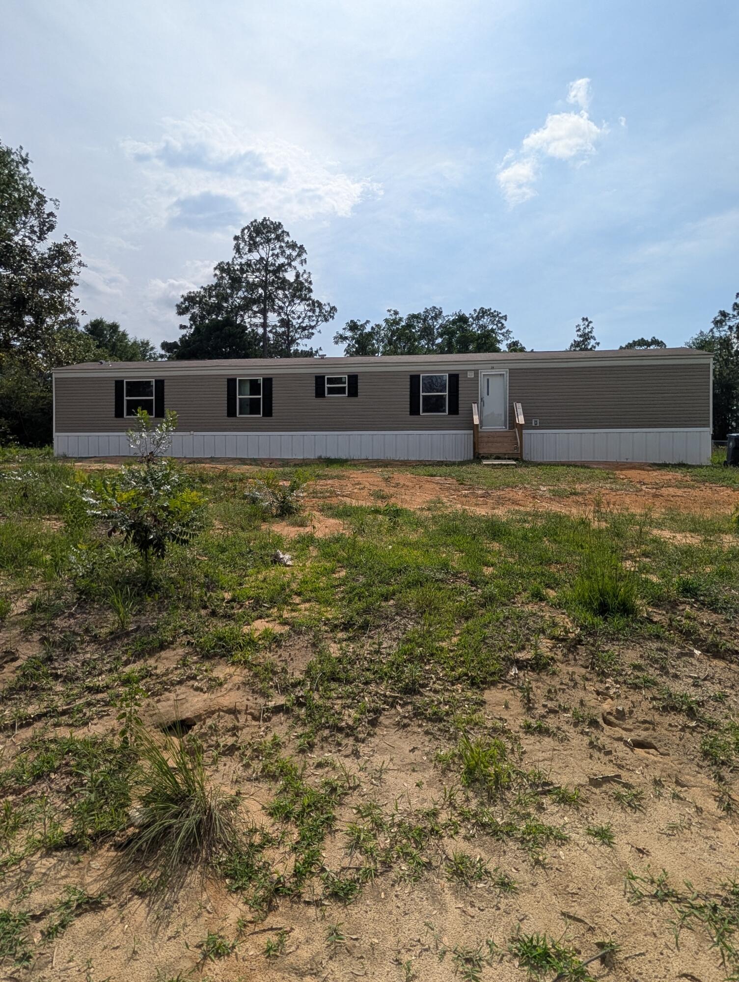 $5,000 closing costs with accepted contract! Brand new 4 bedroom 2 bath mobile home on 1.25 acre corner lot. Property is located in an X flood zone and there is no HOA. Plenty of room for a garden, outbuildings and 4 wheelers. Spacious floor plan with 3 bedrooms and bonus room that can be used for an office or another bedroom as needed. This property may qualify for USDA 100% financing for eligible buyers, with additional low-down payment and closing cost assistance programs potentially available also. Contact selling agent for lending options!