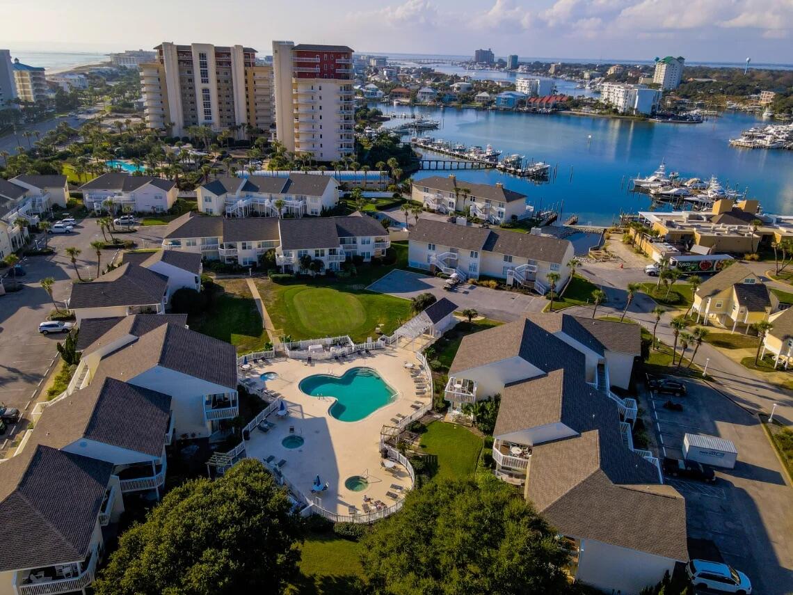 Renovated 1-bedroom condo in a peaceful setting with mature landscaping, golf, and pool views. Enjoy peak harbor views from the front balcony and the bedroom window. The living area boasts large windows overlooking the ninth fairway. The dining area has sliding doors to the private balcony with pool views far enough away to still feel private. The kitchen features updated granite countertops, a breakfast bar, and modern appliances. This furnished turn key vacation rental is ready for you! Call to book your tour today!