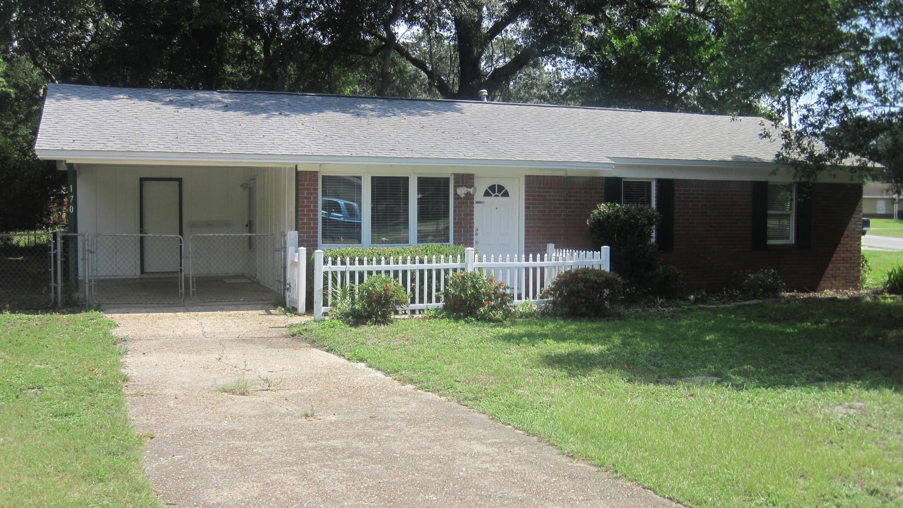 Corner lot completely fenced 3/2 home is ready for move in.  No carpet, all tile flooring. Newer roof, new hot water heater and new outside A/C unit.  Kitchen/dining room features stove/oven, dishwasher. and refrigerator. Backsplash and plenty of cabinets. New tub in hall bathroom. Double-gate to back yard is perfect for parking a boat or RV. This home is convenient to everything and is waiting for it's new owners. Come see it today!