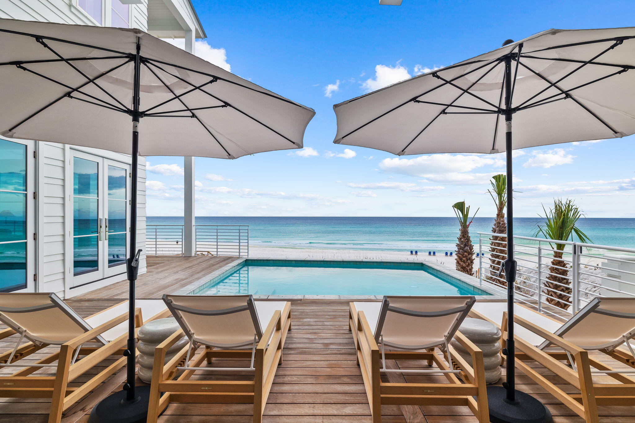 A Gulf-Front Legacy Estate on Scenic 30A!
Introducing 7,911-square-foot of Gulf-front masterpiece set along the pristine white sands of Florida's Emerald Coast. Designed by renowned architect Geoff Chick and impeccably curated by celebrated interior designer Ashley Gilbreath, this extraordinary residence captures the essence of refined coastal living in the heart of Seagrove Beach. Spanning four levels and encompassing eight bedrooms and eleven baths, this private estate offers a rare balance of secluded retreat and grand-scale entertaining. With 68 feet of coveted private Gulf frontage, every day begins with the gentle rhythm of waves and ends with sunsets that paint the horizon in breathtaking color.
The outdoor experience is nothing short of spectacular. A heated saltwater pool over- looks the Gulf, creating a serene vantage point where sky and sea converge. Expansive terraces invite effortless entertaining, while a fully appointed outdoor kitchen sets the stage for elegant alfresco dining beneath the stars. A three-car garage and charming carriage house add both convenience and versatility to this remarkable coastal sanctuary.
Exterior: Coastal Architecture at Its Finest
Set on an expansive 0.6-acre Gulf-front homesite, this four-story architectural statement blends timeless coastal elegance with modern luxury. Its commanding presence is balanced by natural textures and thoughtful design that harmonize with the surrounding seascape.
Outdoor living takes center stage, with sweeping terraces that extend the home's living spaces toward the horizon. The heated saltwater pool glistens against the backdrop of emerald waters, offering year-round enjoyment in a setting that feels both tranquil and grand. From sunset gatherings around the outdoor kitchen to quiet mornings overlooking the Gulf, every exterior detail has been crafted to elevate the experience of beachfront living.
Interior: Curated Luxury and Timeless Design
Inside, the home unfolds into a world of refined sophistication and effortless comfort. The interiors, masterfully curated to reflect a seamless blend of classic elegance and contemporary coastal style. With over $1 million invested in furnishings and design, the residence is offered fully furnished, delivering a move-in-ready experience worthy of its remarkable setting.
The second floor serves as the heart of the home, where a stunning chef's kitchen and expansive living area flow effortlessly onto Gulf-front terraces, the pool, and outdoor kitchen--creating a seamless connection between indoor and outdoor living.
Above, the third-floor primary suite offers a private sanctuary suspended above the shoreline. Floor-to-ceiling views of the Gulf create a serene retreat where luxury and nature exist in perfect harmony.
The fourth floor offers another sitting area, private junior master suite with Gulf views and a game room/workout room with lots of storage and additional space. Every detail throughout the residence--from bespoke finishes to panoramic coastal vistas-reflects an unwavering commitment to craftsmanship, design excellence, and uncompromising quality.
More than a residence, this is a generational coastal estate--an opportunity to own one of the most remarkable Gulf-front homes along Scenic 30A.