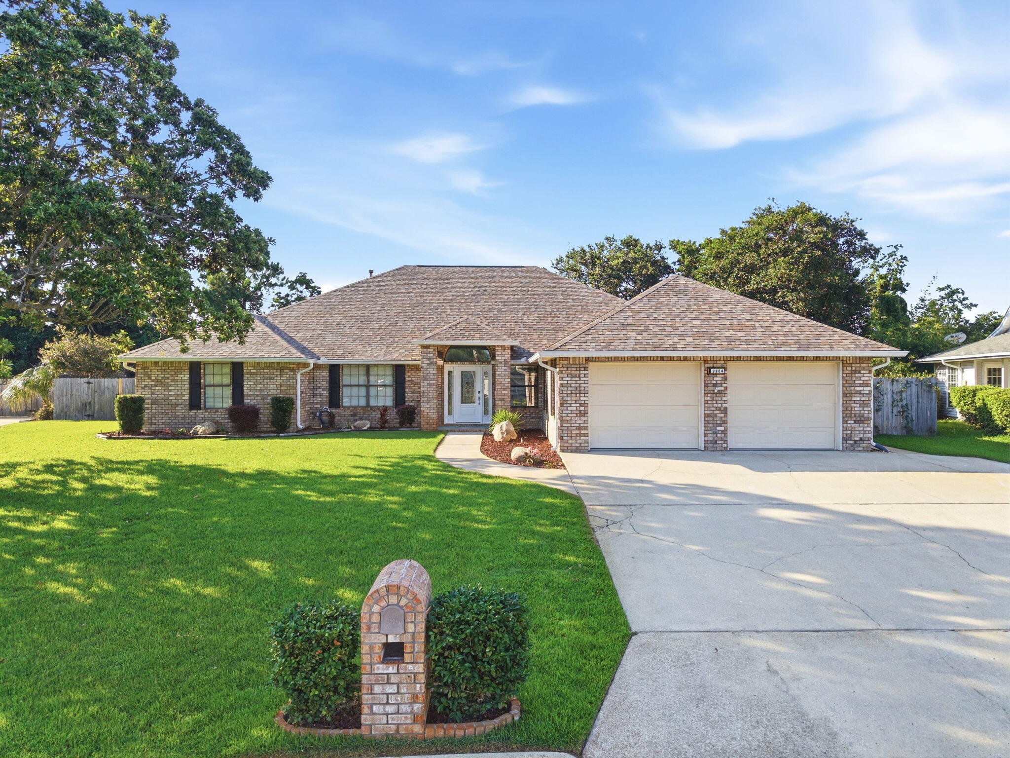 Welcome to your dream home! Nestled in the Tiger Point Village subdivision in Gulf Breeze, this expansive 3,802 SqFt residence offers a functional split floor plan - with 4 bedrooms, 4 full bathrooms, a versatile oversized 2nd floor loft bonus room, a formal dining room as well as an eat-in kitchen, a great room with a gas powered fireplace for relaxing and entertaining, oversized laundry room with cabinetry and a full bathroom, and an oasis of a backyard - with a fabulous screen enclosed lanai and saltwater pool! This GORGEOUS brick home has been updated and remodeled in the past few years - with fresh paint, new flooring, remodeled bathrooms, custom shelving added to all closets as well as the kitchen pantry, and more! The chef's kitchen is the heart of the home, featuring stainless steel appliances, a kitchen island, a pantry with custom glass doors, granite countertops, and a breakfast bar that overlooks a charming breakfast nook. Three of the four bedrooms offer their own ensuite bathrooms - serving as excellent guest rooms or mother-in-law suites. The East wing of the house features a second living area that's connected to one of the bedrooms with ensuite. The massive primary bedroom is an absolute retreat  - with a fantastic oversized walk-in closet with custom organization system and a spa-like ensuite bathroom featuring double vanities, a linen closet, a large soaking tub, a brand new tiled walk-in shower, and a water closet. The screen enclosed patio and screen enclosed saltwater pool in the backyard sets the scene for ultimate entertaining - without the bugs or debris! Your pool will stay sparkling! With the added benefit of being located in flood zone X500 - with no current requirement for flood insurance! Tiger Point Village is a golf cart friendly community, and you're located just minutes away from Tiger Point Park, The Tiger Point Golf Club, The Point Restaurant, and of course the white sandy beaches of Navarre and Pensacola! Schedule your showing today and see this wonderful property for yourself!