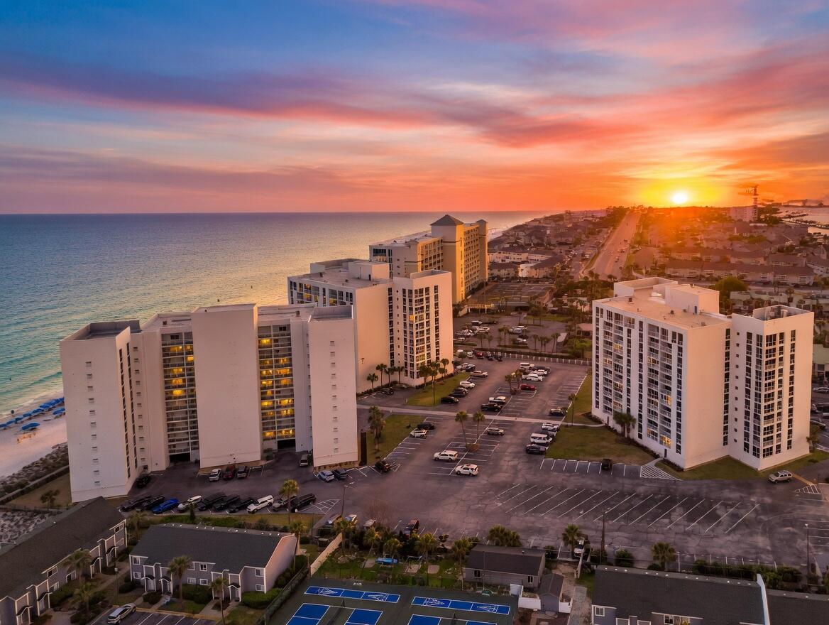 Enjoy Gulf views and peace of mind in this updated 2BR/2BA condo at Shoreline Towers in the heart of Destin. Offering approximately 1,430 square feet, this 4th-floor unit features Gulf views from the kitchen, living room, primary bedroom, and balcony. Interior updates include LVP flooring throughout, an updated kitchen with granite countertops, stainless appliances, upgraded cabinetry, backsplash, and ice maker, plus renovated bathrooms with updated vanities, tile floors, and tiled tub surrounds. Ideal as a primary residence, second home, or short-term rental. Shoreline Towers has recently completed a major multi-million-dollar restoration project, including concrete restoration, exterior painting and waterproofing, new elevators, and updated floor-to-ceiling, high-impact, double-pane, tinted, insulated windows and sliding glass doors. Milestone inspection completed. This gated Gulf-front community offers private beach access, pool, tennis, pickleball, fitness area, community room, sauna/steam room, and more. Conveniently located on Gulf Shore Drive near Harbor Walk Village, shopping, dining, boating, and entertainment. A great opportunity to own an updated Gulf-view condo in a community where major building improvements have already been completed.