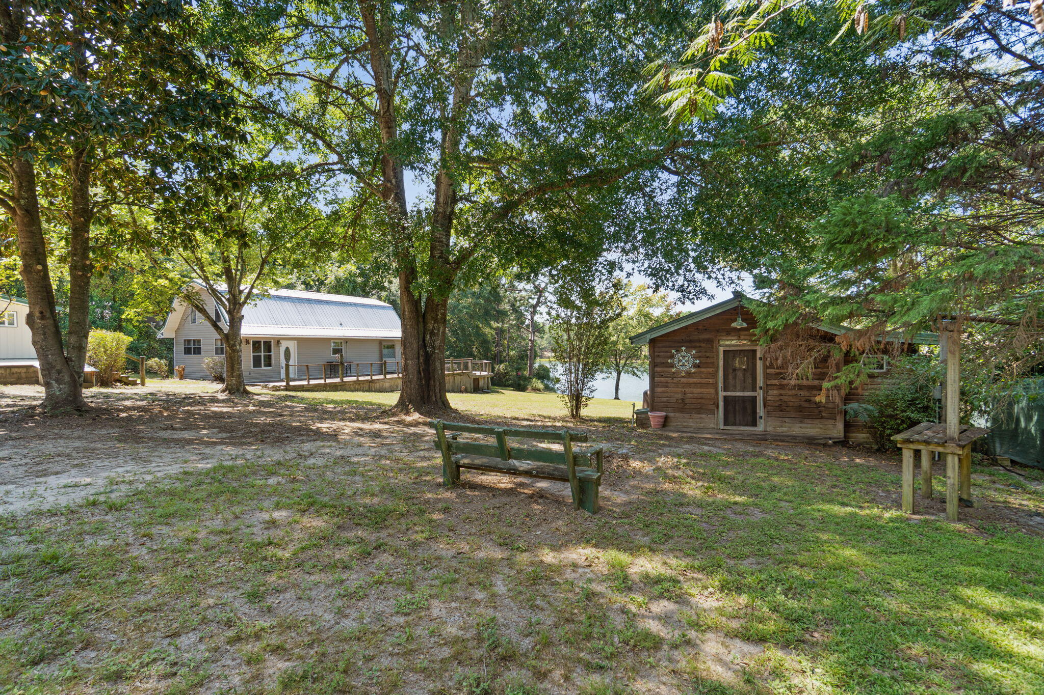 Welcome to 5322 Clint Mason Rd in Crestview, where space, waterfront, and flexibility come together on 2 acres. The main home offers 1,280 square feet with 3 bedrooms and 2 bathrooms, providing a traditional layout with plenty of custom touches but ways to make it your own.

One of the standout features of the property is the 4-car garage/shop, offering excellent space for vehicles, equipment, hobbies, storage, or a workshop. A separate storage shed provides additional room for tools and outdoor items.

The property also includes a 334-square-foot ADU cabin, built in 2016, providing additional living space for guests, family, a home office, or other uses. The cabin adds flexibility that is hard to find with a property of this size and price point.

Outside, enjoy approximately 150 feet of waterfront with a private dock, giving you direct access to the water and plenty of opportunity to enjoy the outdoors. With 2 acres, a 3-bedroom main home, detached cabin, large garage/shop, storage shed, and waterfront access, this property offers a combination of features with plenty of possibilities for its next owner.

Schedule your showing today and come see everything 5322 Clint Mason Rd has to offer.