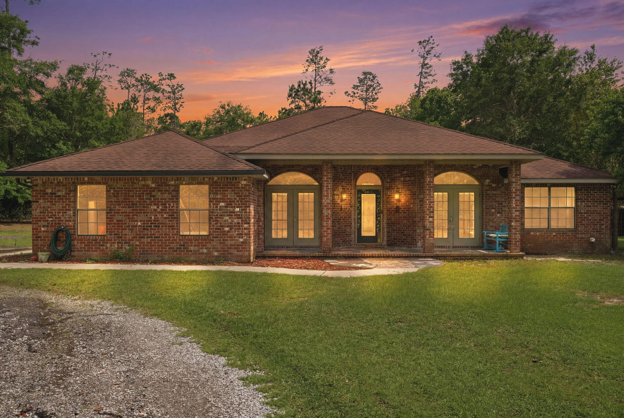 Welcome to this gorgeous private estate featuring a sparkling pool with waterfall feature, nestled on just under 9.8 acres in beautiful Northwest Florida. This stunning four-bedroom, three-full-bath home offers the perfect blend of comfort, privacy, and outdoor recreation. Inside you'll find a spacious kitchen designed to impress with white cabinetry accented by glass-style doors, sleek quartz countertops, a gas stove, and stainless steel refrigerator. The thoughtfully designed layout allows multiple rooms along the back of the home to showcase beautiful pool views while also providing direct outdoor access, creating a seamless indoor-outdoor living experience. The front portion of the home offers additional versatility with a formal dining room and a flex space that can easily serve as a home office, second living area, playroom, workout room or additional entertaining space to fit your lifestyle needs. Step outside and experience everything this 9.72-acre property has to offer. A peaceful pond welcomes you near the front of the property, while cleared trails wind throughout the acreage ideal for side-by-sides, ATVs, golf carts, or other outdoor recreational vehicles. Adjacent to the pool area you'll discover a charming cottage-style cabin that adds even more character and functionality to the property. This unique space could serve as quest quarters, additional living space, a private retreat, playhouse, hobby room, or anything else that you can imagine. Surrounded by nature, this property delivers the privacy and serenity many buyers are searching for, complete with a private drive leading from the street up to the home. Whether you're looking for a personal retreat, entertaining space, or acreage to enjoy the outdoors, this one-of-a-kind property offers endless possibilities. SELLERS WILL REPLACE THE ROOF AND SCREENED-IN POOL AREA WITH ACCEPTABLE OFFER!