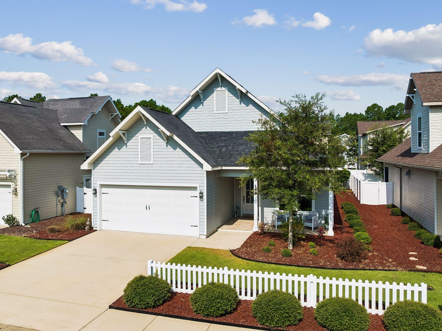Meticulously maintained and thoughtfully designed, this beautifully appointed single-level residence offers the perfect combination of quality craftsmanship, comfortable living and everyday convenience. Built by respected local builder Boswell Builders. Spanning 1,872 square feet with three bedrooms and two-and-a-half bathrooms, the home features an open-concept floor plan enhanced by timeless finishes and an abundance of natural light. Ten-ft. ceilings with crown molding create an airy atmosphere while engineered hardwood flooring extends throughout the main living areas, adding warmth and sophistication. Privately situated, the spacious primary suite provides a relaxing retreat with dual vanities, a beautifully tiled walk-in shower and ample storage. Two additional generously sized bedrooms each feature walk-in closets, offering flexibility for family, guests or a home office. Every detail reflects the exceptional care this home has received, making it truly move-in ready. Paradise Cove is a peaceful community bordered by a natural preserve, creating a quiet setting while remaining close to everyday conveniences. Sidewalks line both sides of the neighborhood streets, inviting leisurely walks, and residents enjoy access to a picturesque community swimming pool. Conveniently located near shopping, dining, schools and the white-sand beaches of the Emerald Coast, this home offers an exceptional opportunity to enjoy the area's renowned coastal lifestyle.