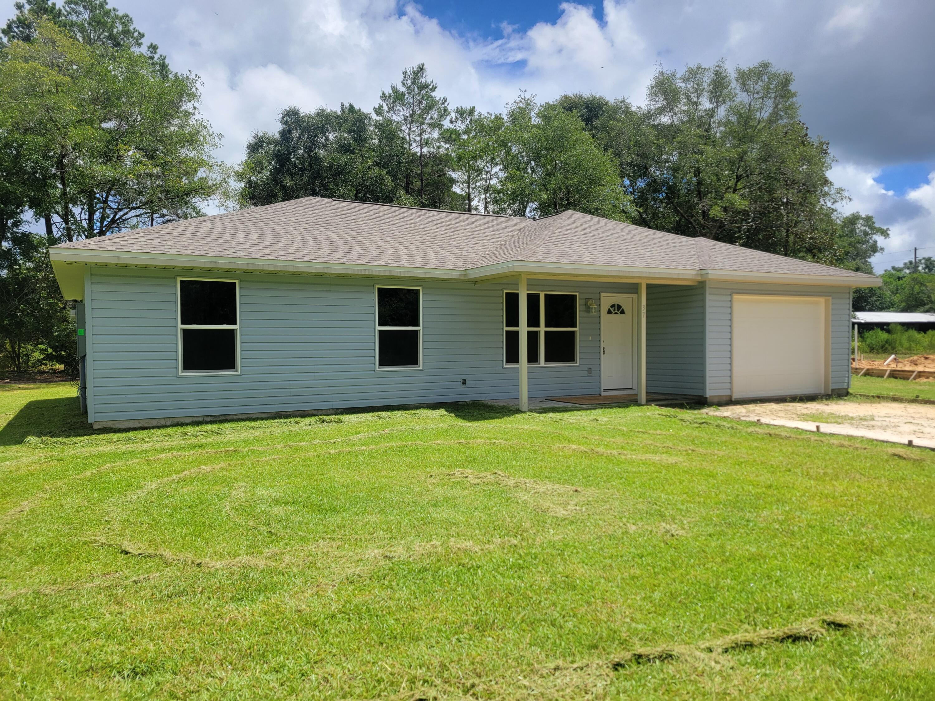Under construction now!   NEW home with pre-approved Buyer you may be able to still select color of siding and interior and floors.  Heated living space is 1275 sf, central air/heat, shingle roof, with 3 bedrooms, 2 bathrooms, stove and dishwasher PLUS a garage 321 sf and porches 67 sf.  Appx. 30 minutes to Eglin AFB or Crestview, FL.  Appx. 40 minutes to Destin, FL.  
Make this home yours by contracting now and make it your own.  Look under documents for floor plan.  Seller is contributing $10K towards all closing costs inclusive of all title insurance fees and charges and doc. stamps and any other Buyer's fees and Lender's fees.  Completion Date estimate 1/15/2027.