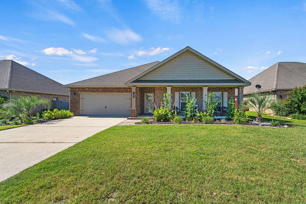 Welcome to 417 Chickadee Street, a beautifully maintained home in Redstone Commons where thoughtful upgrades shine throughout. From the moment you arrive, you'll notice the refreshed landscaping and inviting covered front porch, setting the stage for an equally impressive interior.

Inside, upgraded Lifeproof luxury vinyl plank flooring flows throughout the home, creating a cohesive and stylish look. The entry is accented with wainscoting and fresh trim details, while updated Harbor Breeze ceiling fans and lighting add a polished finishing touch. The kitchen is equipped with a Samsung Wi-Fi refrigerator, smart stove, dishwasher, and enhanced wood pantry shelving, with additional shelving added throughout the bathrooms and primary linen storage for even more functionality.

The upgrades continue outside, where the landscaping has been completely refreshed with new plants, rock accents, and shrubs. Backyard sprinklers make maintaining the outdoor space easier, while an added storage shed provides extra room for tools and equipment. The garage is made even more versatile with its own mini-split system, offering a comfortable space for hobbies, a workshop, home gym, or additional flex space.

Located in Redstone Commons with convenient access to shopping, dining, schools, and everything Crestview has to offer, this home combines everyday functionality with upgrades that have already been done for you. Come see what makes 417 Chickadee Street stand out!