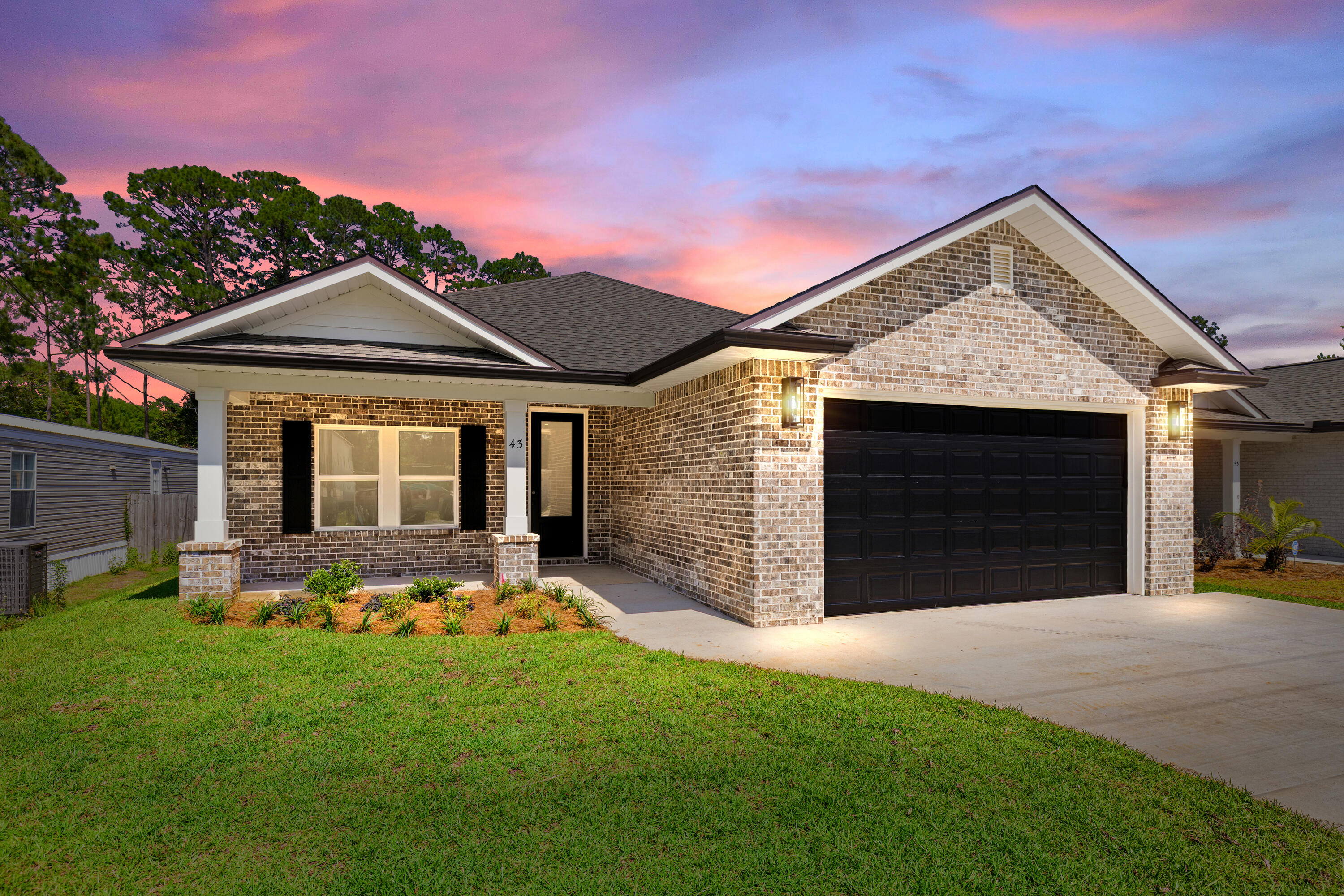 Stunning craftsmanship with southern charm in this new construction, all-brick, 4-bedroom, 2-bath home. This modern home features 2040 sq.ft. with high-end custom finishes and exceptional detail. Less than 2 miles East of Bluewater Bay and the Mid-Bay Bridge surrounded by new construction! This move in ready home blends timeless quality with today's modern   features.  The kitchen is a true show-stopper, designed with both style and functionality. Featuring white maple shaker cabinetry with soft-close drawers, a farm sink, white ceramic back-splash, quartz countertops, steel Whirlpool appliance package, and pantry. The oversized 8ft island and the 8ft coffee bar with wine refrigerator add the perfect finishes!  Premium LVP flooring throughout the entire home, paired with crown molding and reverse trey ceiling with lighting, providing a seamless aesthetic.  Additional features include a floor outlet in the family room, perfect for lamps or phone chargers without obstructing walkways and the reverse trey with custom lighting with a remote providing a color choice for every season. $10,000.00 towards buyers closing cost, prepaids or buydown the rate. This open concept of natural light with large high-impact windows, neutral finishes and modern lighting give this home a warm and welcoming feel.  As you enter the spacious primary suite, you're greeted with natural light and you'll love the reverse trey with custom changeable lighting. Especially in the evening! The spa-like bathroom is beautifully accented with a 6ft soaking tub with shiplap accents, custom led lighting behind the mirrors with changeable colors. A custom tile shower features a built-in bench, rain head, front sprayer and a handheld sprayer conveniently placed beside the bench. Custom shelving makes the walk in closet perfect for organization. The Laundry room has a custom folding table with quartz countertop, and built-in shelving. When you want to relax, and rewind, the back yard is the place! You'll enjoy a screened in porch with ceiling fan, flood lights on each end of the house and an extra paver pad across the back of the home for a full patio set and grill. Maintenance is easily obtained with this fully sodded yard, sprinkler system that works off a separate well and a 8 ft. privacy fence. Gutters are installed around the entire house. For energy efficiency, the builder has installed upgraded spray foam in the roof. You will also enjoy the storage above the garage along with the upgraded epoxy garage floor. This builder takes great pride in his homes and it shows! Seven more new homes are under construction. The builder is offering $10,000.00 towards the buyers closing cost, doc stamps on the deed, split title insurance and all title related fees. Restaurants, boat launch, Eglin Air Force Base, Special Forces, Emerald Coast beaches, shopping, hospitals and more are very close. Call today for a viewing.