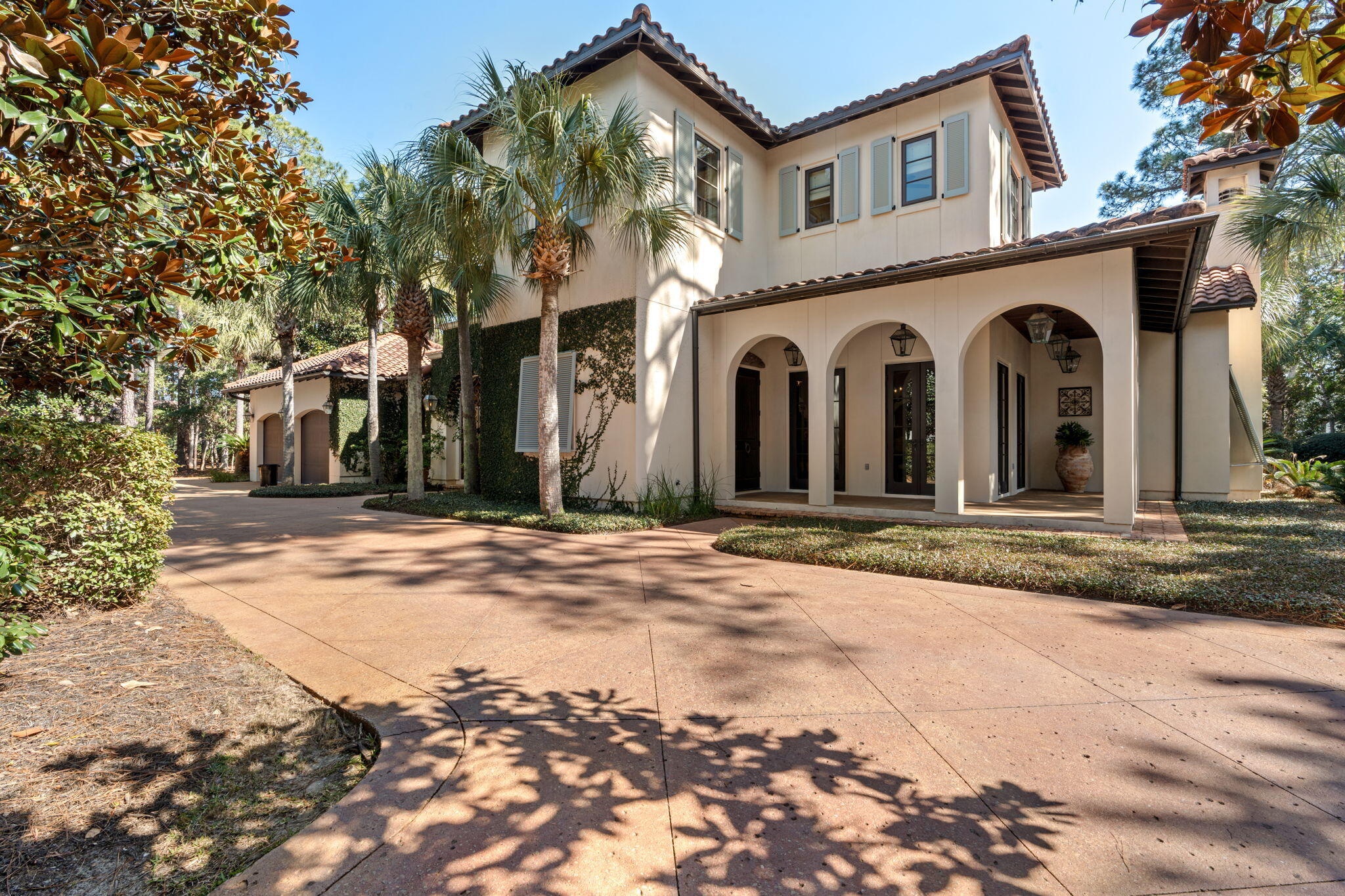 Tucked behind beautiful, private gates on a desirable corner lot, this exquisite Italian-inspired custom-built home blends timeless charm with modern upgrades in one of Sandestin's most sought-after neighborhoods. A brick courtyard with lush landscaping, ivy-covered walls, a sparkling pool, and a rare 18th-century Italian marble fountain create a captivating first impression. On a half-acre lot backing onto a tranquil wooded area.
The open-concept interior features terra cotta pavers, period-style detailing, and a gourmet kitchen with a gas stove, double oven, wine fridge, and a large island—ideal for entertaining. Adjacent are a cozy ''keeping room'' with fireplace, a small study, and convenient laundry. The spacious great room flows onto a covered patio with a summer kitchen and... ..surround sound, perfect for alfresco dining. The first floor master suite offers a private seating nook and dual His and Her bathrooms for ultimate luxury. There is also an upstairs guest room with a charming seating area, offering comfort and privacy. A guest house off the courtyard features a bedroom with a balcony overlooking the pool, plus a living room and convenience kitchenperfect for visitors, a studio, or office.
Additional highlights: guest "suites" provide ultimate comfort and privacy, increased sleeping space with sofa-beds throughout, grand foyer with staircase, hurricane doors/windows, workable shutters, fenced yard, walk-in attic, ample storage, two-car + golf cart garage, and circular driveway.