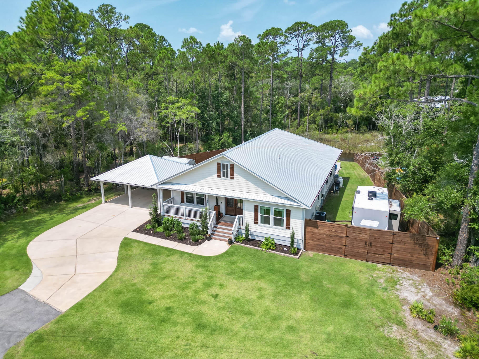 A Beautiful canal front home with a pool in the heart of Santa Rosa Beach offers access to the Choctawhatchee Bay via jet ski, paddleboard, kayak, or bay boat! Upon entering the home you will be welcomed into a spacious foyer that leads to the open concept living spaces.  A spacious kitchen, great for entertaining provides plenty of counter space, cabinets, and a large island in addition to a spacious pantry. The great room,  adjacent to the kitchen includes a gas fireplace and access to the back porch which spans the full width of the home. Three bedrooms, and 2.5 bathrooms finishes out the home along with a full laundry room and 2 car carport. Just 5 minutes from award winning restaurants, and 10 minutes to the beautiful beaches of 30A.