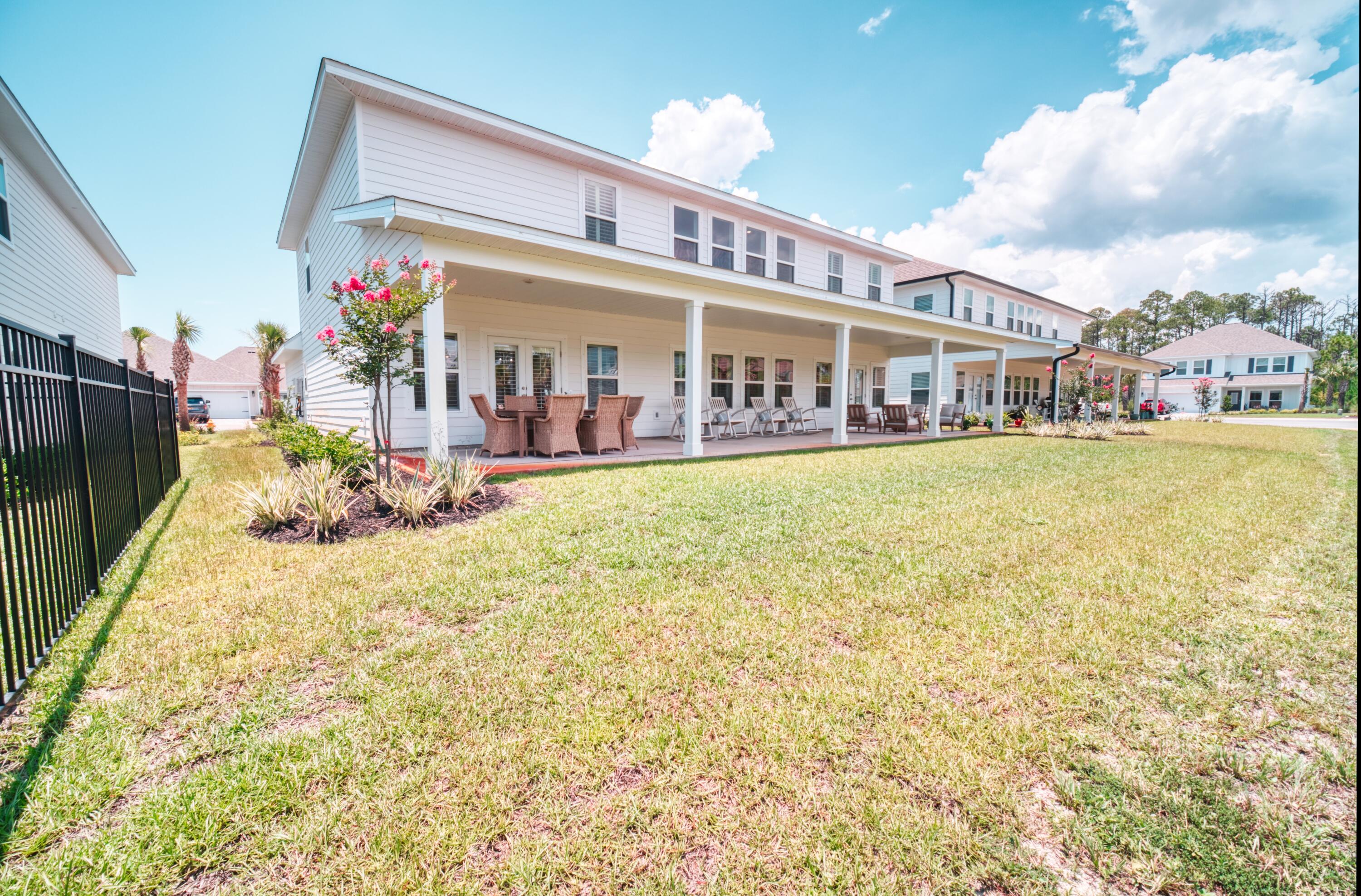 Welcome to coastal living less than a mile away from white sand beaches and turquoise water.  Beautiful craftsman-style house offers a generous 4,425 square feet of living space allowing plenty of room to entertain and relax. Six spacious bedrooms and four tastefully designed bathrooms, this home provides an abundance of space for you and your loved ones.
As you step inside, you will see the attention to detail showcased in the custom finishes throughout the house. The interior combines elegance and comfort with a chef inspired kitchen and  two expansive living rooms, the perfect setting for both entertaining guests and enjoying cozy evenings with family. Garage has been finished in epoxy flooring with storage shelving and bonus space above the garage has been finished as well to be used as an office, playroom or climate controlled storage. Outdoor kitchen with built in gas grill, flat top and storage. Main living room has built in media console, bookshelf and storage cabinets.