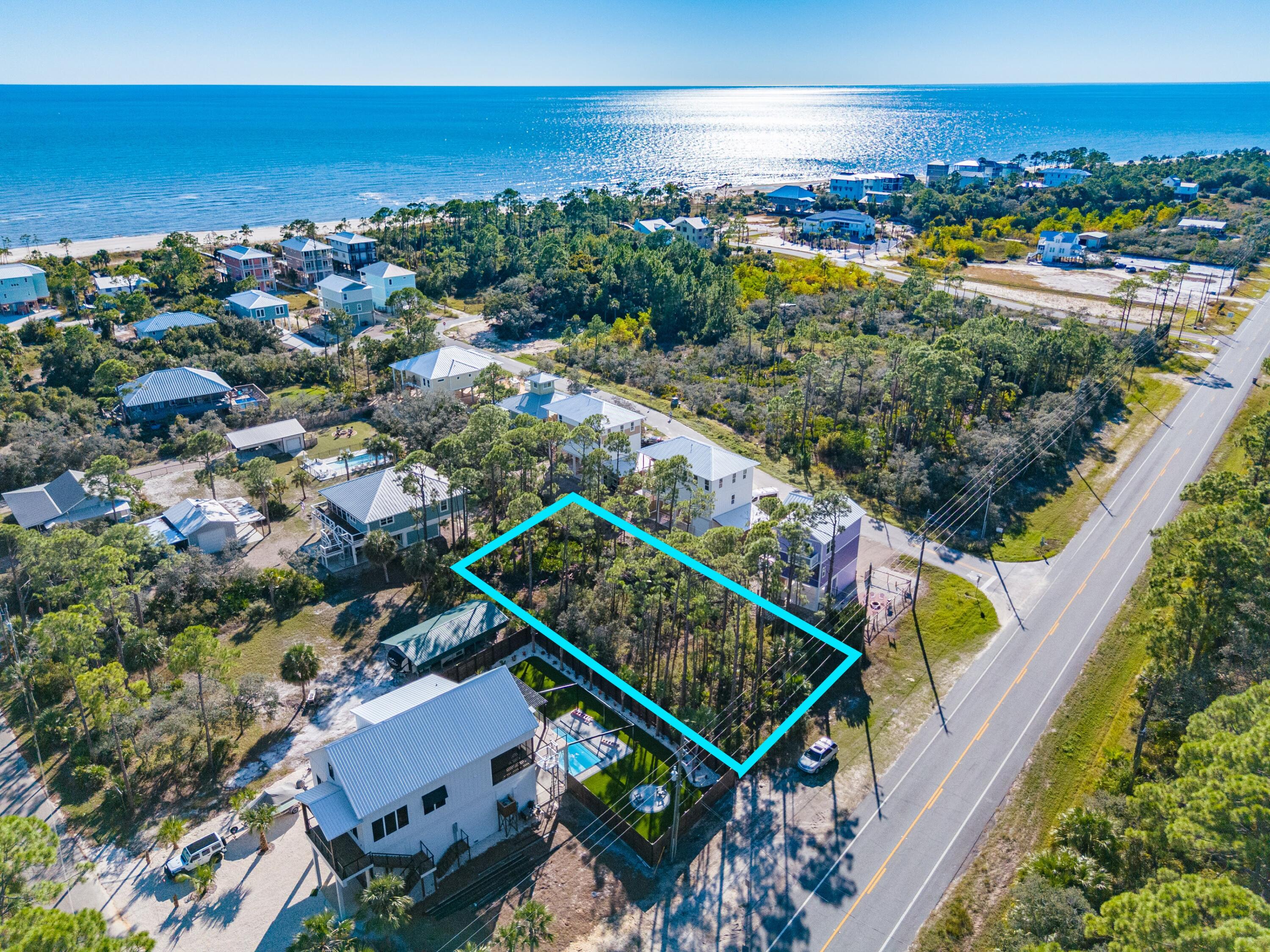 Discover the perfect canvas for your coastal dream home in Indian Pass! This prime lot directly on Indian Pass Rd offers a fantastic opportunity to build your custom home with the incredible benefit of NO HOA. The property is level and ready for construction. Beautiful new beach homes are being constructed and sold in the surrounding area, underscoring the value of this location. Imagine designing your ideal beach getaway, perfectly tailored to your tastes, just a short stroll from the white sand. The beach access is right down the street. Indian Pass is renowned for its wide, pet-friendly beaches. Spend your days enjoying the sun, sand, and surf on these wonderful shores. This is the laid-back, 'Old Florida' lifestyle you've been searching for. Plus, you're not far from the Indian Pass Raw Bar and General Store. For the avid boater or fisher, a public boat launch is minutes away, providing direct access to Indian Pass Lagoon, Apalachicola Bay, and the Gulf of Mexico. Additionally, the charming shops, marinas, and waterfront restaurants of historic Port St. Joe are just a quick drive. Don't miss this chance to own a piece of paradise. This isn't just a lot; it's the beginning of your new coastal life. Take a drive to see it for yourself!