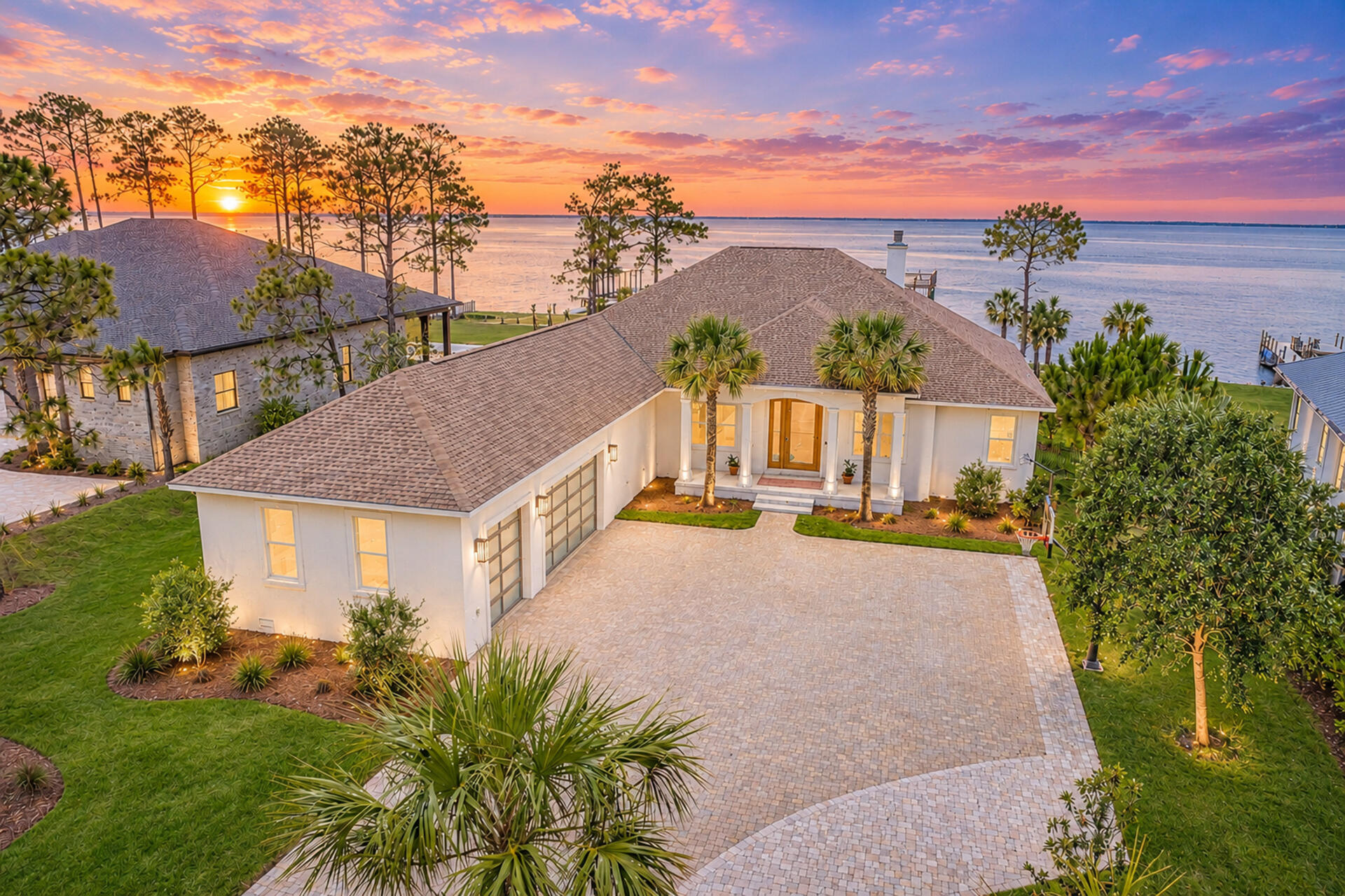 Set along 110 feet of private frontage on the Choctawhatchee Bay, 1341 Driftwood Point Road presents a rare opportunity to experience refined waterfront living in the heart of Santa Rosa Beach. Positioned on 0.87 acres and completely transformed through more than $1 million in carefully curated renovations and upgrades, this exceptional bayfront residence blends sophisticated modern design with effortless coastal luxury. Panoramic water views, unforgettable sunsets, and seamless indoor-outdoor living define the property, while six expansive sliding glass doors flood the home with natural light and create a seamless connection to the outdoor entertaining spaces. The resort-style setting features an oversized pool and spa, expansive paver sundeck, multiple lounge and dining areas, and beautifully maintained bayfront grounds designed to maximize both privacy and views. Inside, white oak flooring, artisan clay tile, custom finishes, and warm organic textures create a timeless, elevated atmosphere throughout the home. Inside, the residence offers four bedrooms, three full bathrooms, a private office with custom glass-and-brass partition doors, and a media room anchored by a dramatic white oak feature wall. The chef's kitchen serves as the centerpiece of the home with a stunning 5' x 12' quartzite island, custom white oak shelving, all-new cabinetry, and premium side-by-side refrigerator and freezer columns. Additional highlights include oversized primary closets, floating vanities, a designer mudroom, and a beautifully appointed laundry room.

Extensive improvements throughout the property create a true move-in-ready luxury experience, including two HVAC systems, a whole-home Generac generator, spray-foam insulation, custom garage doors, gas lanterns, and a newly installed seawall for long-term peace of mind. The double-decker Trex dock with boat lift and oversized three-car garage with 13-foot ceilings offer exceptional convenience for boating enthusiasts and coastal living alike.

Perfectly positioned just minutes from the white-sand beaches of 30A, premier dining, boutique shopping, marinas, and top-rated schools, this remarkable bayfront retreat offers an unmatched blend of privacy, craftsmanship, location, and lifestyle.