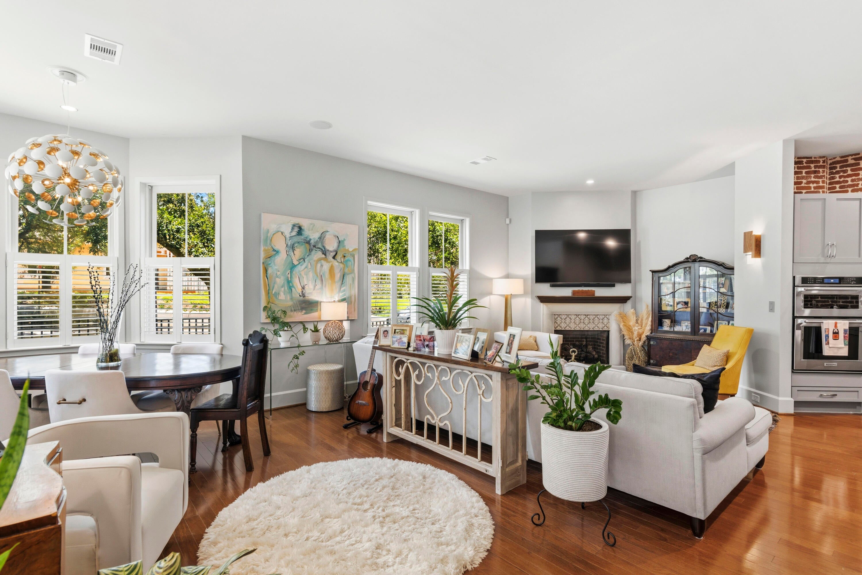 A three-bedroom corner residence in The Court of North Hill? That's not just rare...it's almost unheard of. The best homes don't force you to choose between location and livability. This one gives you both. Perfectly positioned inside one of Downtown Pensacola's most coveted gated communities, this nearly 2,000-square-foot residence lives more like a custom home than a condo. Wrapped in natural light from three sides, the coveted corner floor plan creates an airy, inviting atmosphere that's difficult to find downtown. The heart of the home is equal parts timeless and unexpected. Exposed brick, granite countertops, gas cooking, stainless appliances, and custom cabinetry bring warmth and character to the beautifully designed kitchen, while the open-concept living spaces make entertaining feel effortless. Whether it's dinner with friends, football Saturdays, or a quiet morning coffee, every space feels intentional. The primary suite is exactly what you hope for at the end of the day; spacious, peaceful, and complete with a sitting area, spa-inspired bath, oversized closets, and private access to your own balcony. Two additional bedrooms provide flexibility for guests, a home office, or growing families. Outside your front door, Downtown Pensacola becomes your backyard. Grab dinner without planning ahead, walk to festivals and galleries, meet friends for coffee, or spend weekends at the waterfront. When you're home, enjoy the privacy of a gated community with a resort-style pool and hot tub, plus the convenience of a two-car garage and true lock-and-leave living. Homes like this simply don't become available often. For buyers wanting downtown convenience without sacrificing space, style, or comfort, this is the opportunity you've been waiting for.