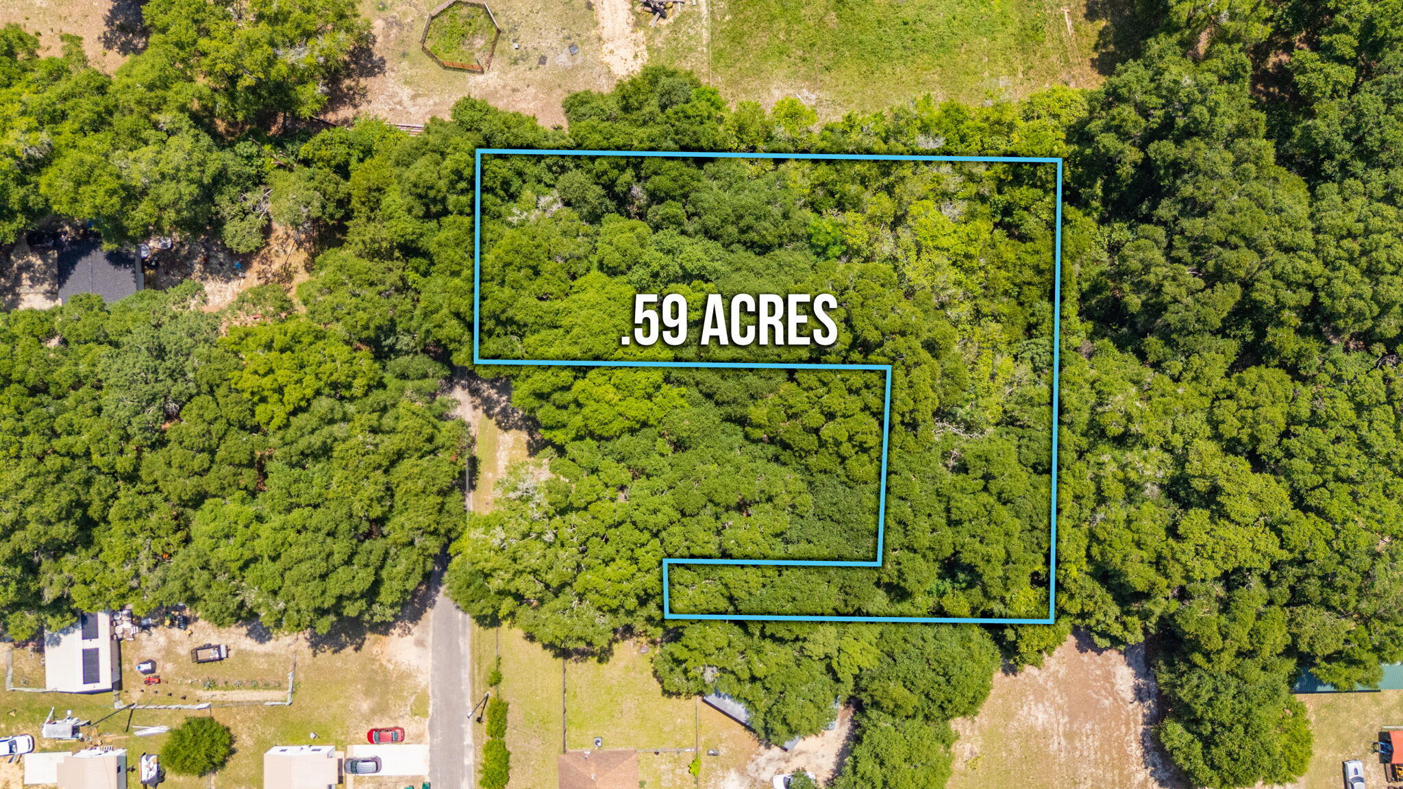 Large residential lot conveniently located in the city limits of DeFuniak Springs. This property is over half an acre and on a paved road. Fully wooded with beautiful mature trees. You can clear the whole lot or leave some nice shade trees. Mobile homes NOT allowed.