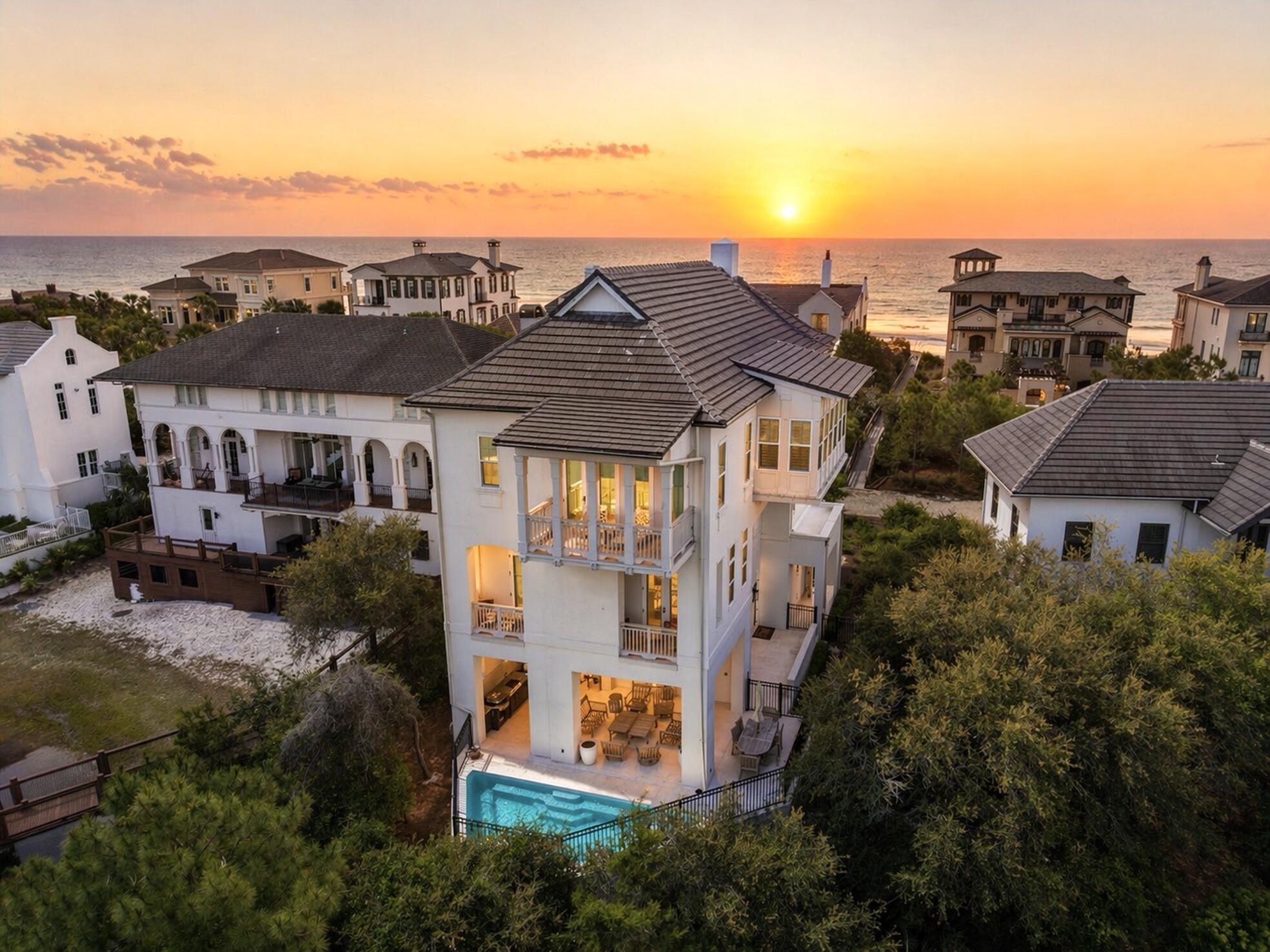 Welcome to an exceptional coastal retreat in the gated, non-rental community of Stallworth Preserve — 68 Stallworth Blvd. This masterfully designed 3-story home, built in 2021, embodies refined beach living with sweeping views of the white sand beach and emerald green waters of the Gulf. As if Gulf views weren't enough, this gem is located on a coastal dune lake as well. Step inside to discover ~3,908 sq ft of living space highlighted by 5 spacious bedrooms and 7 baths (five full, two half). On the ground level you'll find a welcoming entry, laundry area, a two-car attached garage, and an amazing outdoor living area complete with a summer kitchen and a private pool — all overlooking the serene coastal dune lake. Upstairs, four bedrooms each come with their own ensuite bath, offering privacy and comfort for residents or guests. The top floor is dedicated to living at its finest: a luminous living room, dining area, and gourmet kitchen all arranged to maximize the stunning Gulf and lake views. Also on this level is an expansive master suite, making this the ultimate retreat space. This home combines beach house charm with modern amenities: double-pane windows, storm-ready doors, ceiling fans, a tankless water heater, and efficient electric systems. Outside, the property sits on an ~8,712 sq ft lot in a private, secluded enclave with direct beach access located just across the driveway. A rare find in this prized 30A neighborhood. Whether you're seeking a luxury retreat, a coastal vacation base, or a high-end investment property, 68 Stallworth Blvd presents a rare opportunity combining privacy, panoramic water views, and turnkey elegance, in a location that offers both serenity and access to the Gulf.
