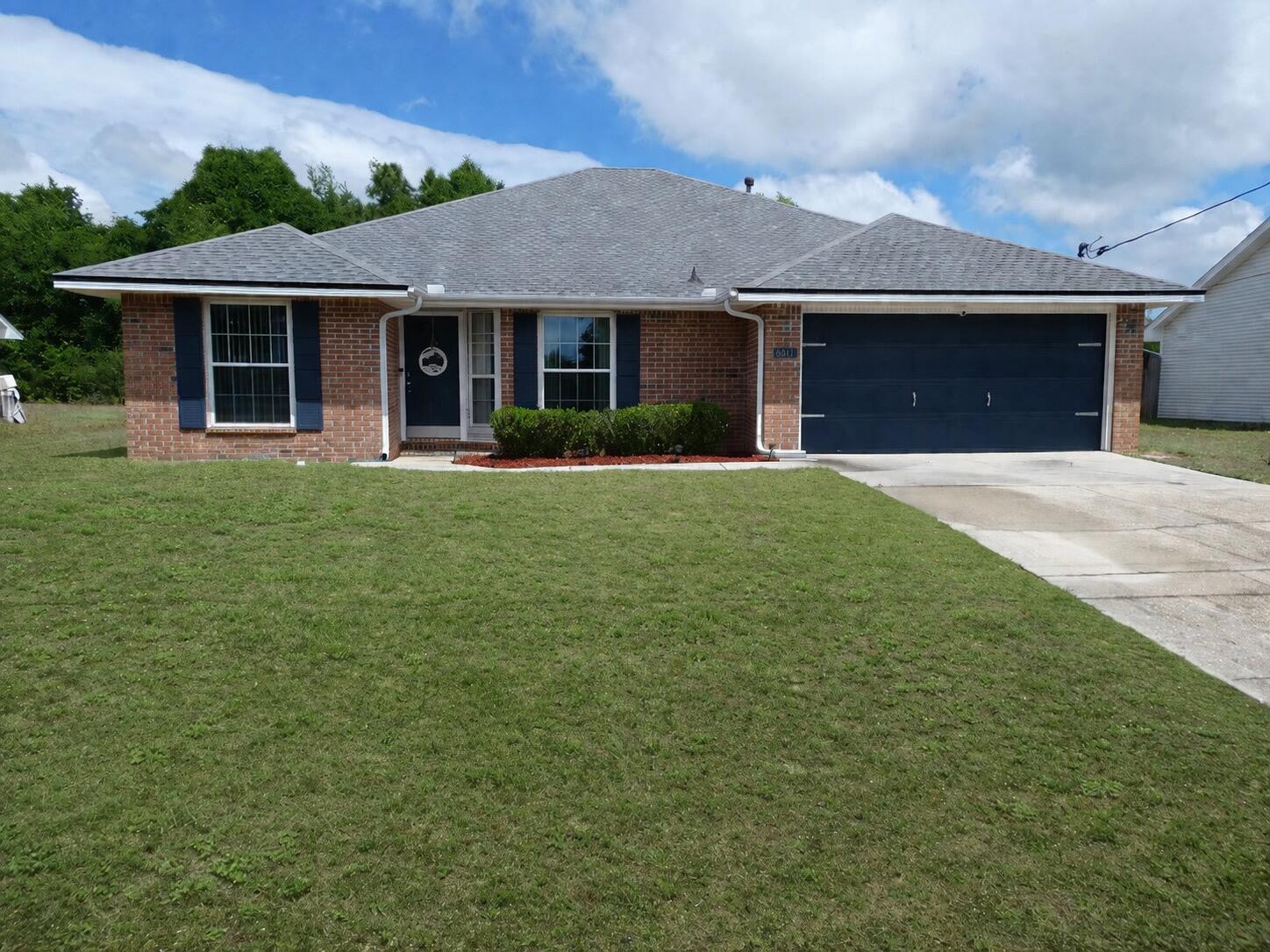 Welcome home to this beautifully maintained 4-bedroom, 2-bath property offering comfort and space. With a two-car garage and a long list of recent improvements--including a new roof 2020, AC system 2018, pool liner 2025, front windows 2024, and hot water heater 2024--you can move in with peace of mind. All kitchen appliances in addition to laundry machines will stay with the property!     Inside, you'll find a spacious primary bedroom and an expansive living room featuring high ceilings that create an open, airy feel. The home also offers several walk-in closets, providing ample storage for everyday living.    Step outside to enjoy a large, fully fenced backyard complete with a fenced-in pool--perfect for relaxing or entertaining. A screened room adds even more versatile space to enjoy Florida living year-round.  Ideally located within walking distance to one of the area's highest-rated elementary schools, this home also offers convenient access to major highways and an easy commute to Eglin Air Force Base.    As an added bonus, the seller is offering a $5,000 flooring credit with a full-price offer--giving you the opportunity to customize the space to your style.    This property has a 2.75% VA assumable mortgage. Assumption of this loan is only for VA eligible personnel.     This home truly combines location, upgrades, and lifestyle--don't miss your chance to make it yours!