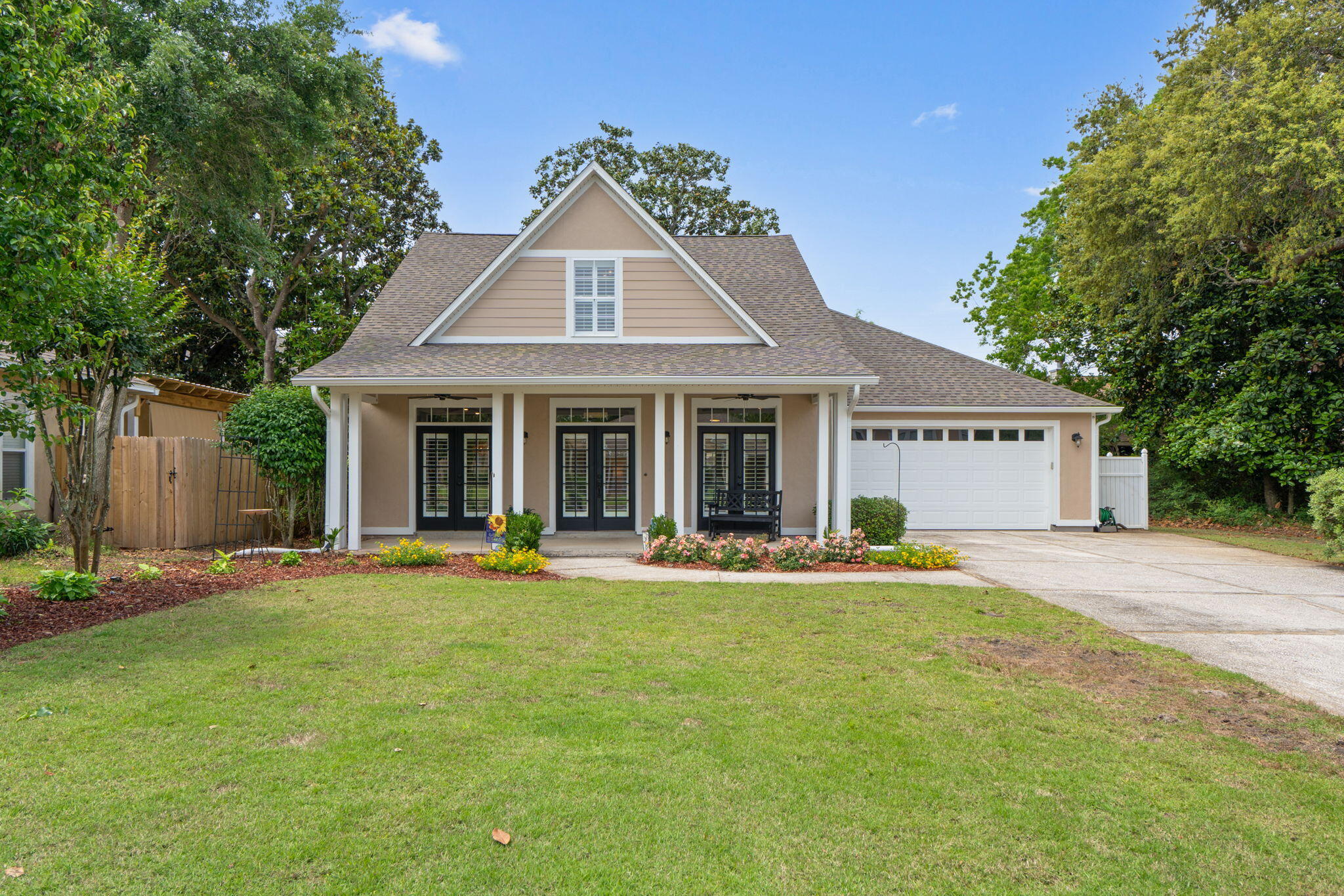 Welcome to this stunning 3-bedroom, 2.5-bath home with charming 30A cottage vibes, perfectly situated on a quiet cul-de-sac in the sought-after waterfront community of Magnolia Harbor. From the moment you step inside, you'll appreciate the beautiful hardwood floors, soaring ceilings, and the light-filled open-concept living space designed for both comfort and entertaining. The oversized primary suite is conveniently located on the first floor, offering a private retreat with ample space to unwind.
Upstairs, you'll find two generously sized bedrooms along with a versatile bonus room--perfect as a fourth bedroom, media room, or playroom to suit your needs.This immaculate home has been meticulously maintained and thoughtfully updated, featuring plantation shutters throughout, fresh interior and exterior paint, resurfaced floors, and a newer roof.
With its coastal charm, modern updates, and prime location, this home offers the perfect blend of style, comfort, and functionality.