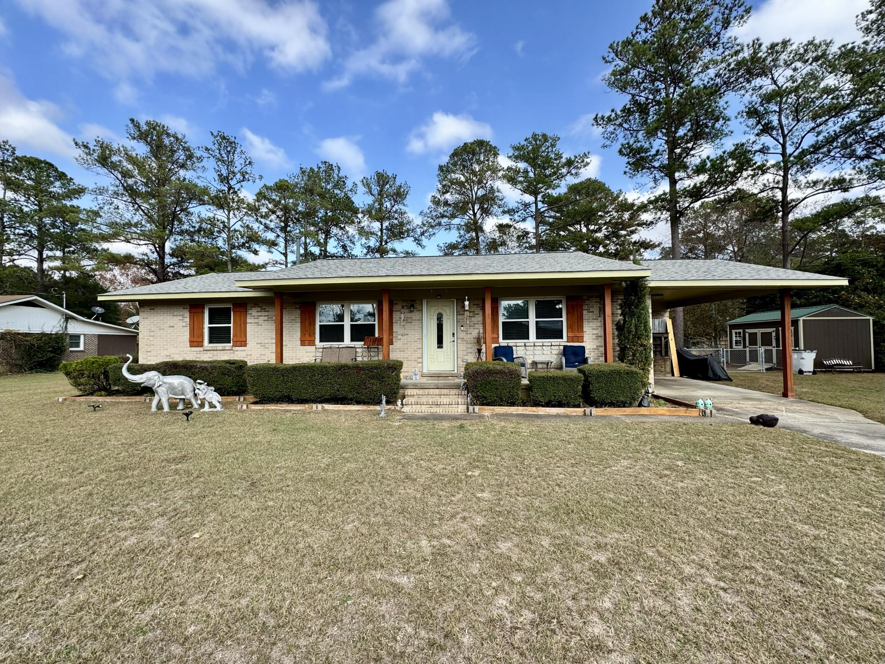 Updated 3BR/2BA brick home in Brookdale on .68 acres! Features include an attached carport, LVP flooring throughout, remodeled baths, retractable screen doors, and enclosed patio area added in 2024. Outdoor amenities include a 16x32 chlorine above-ground pool with deck (2024), fire pit area (2025), small fenced area (2023), storage shed with electricity (2024), and additional shed with exterior water faucet. Major updates include new roof and water heater (2023), new HVAC system (2025), new stovetop (2024), and new exterior light fixtures and electrical outlets (2024). Lots of extras! Move-in ready with modern upgrades inside and out! The home is in a flood zone.