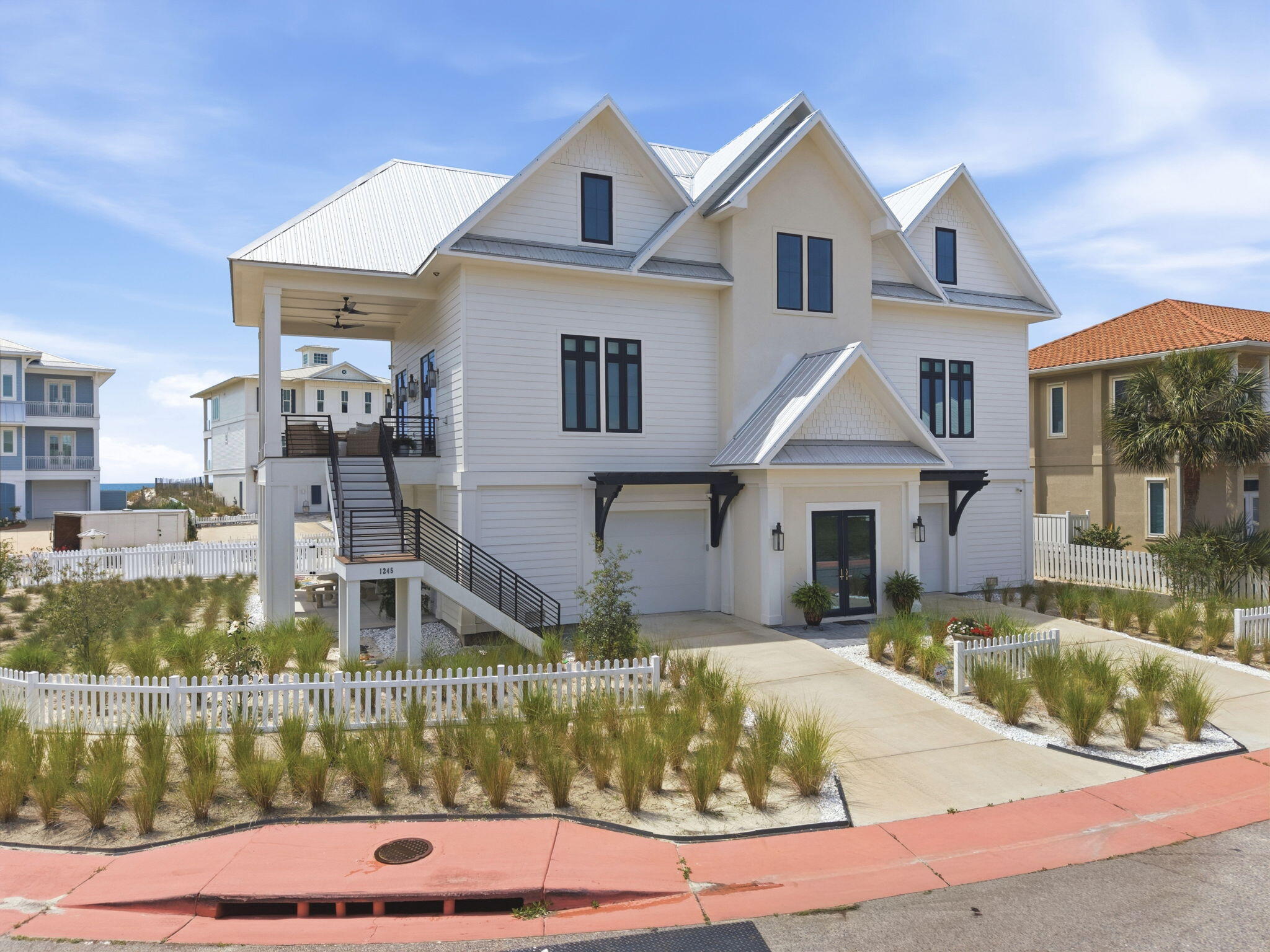 Newly built in 2025, this 4-bedroom, 3.5-bath custom home with elevator offers refined coastal living in the highly desirable Parasol community of Perdido Key. Enjoy stunning views from multiple porches along with approximately 900' of private Gulf-front beach access reserved exclusively for Parasol owners. Designed with exceptional craftsmanship & upscale finishes throughout, this home is the perfect balance of elegance & luxury coastal living. Every inch of this beach home is touched with beauty, and the thoughtfulness in the design stands out. Step inside where the antique pine flooring flows throughout the entire residence, which is complemented by extra touches of crown molding, rounded sheetrock corners, antique wrought iron chandelier & all poplar inset cabinetry with Orleans raised panel doors. The chef's kitchen is truly impressive with a Wolf 48" dual fuel range, Sub-Zero 48" side-by-side refrigerator, KitchenAid undercounter ice maker, Fisher & Paykel double drawer dishwasher, instant hot water dispenser & an oversized 9'x5' cypress island topped with stunning Rhino White Calcite countertops. Additional Rhino White Calcite surfaces continue throughout the baths. Spa-inspired bathrooms feature elegant Thassos marble shower enclosures & tub surrounds along with Kohler fixtures. The spacious primary suite includes a large walk-in closet with custom built-ins. Built for peace of mind, the home also features a metal roof, Trane HVAC system, whole-home 38kW liquid-cooled generator, two Rinnai tankless water heaters, & hardwired Honeywell security system. Additional highlights include Hunter Original ceiling fans, powder-coated interior & exterior railings, gas lanterns on the front & rear porches & an Isokern gas fireplace with gas logs for added charm. Parasol is one of Perdido Key's premier rent-restricted communities, offering privacy, exclusivity & an unmatched coastal lifestyle. Experience coastal living at its finest - Schedule your tour today!