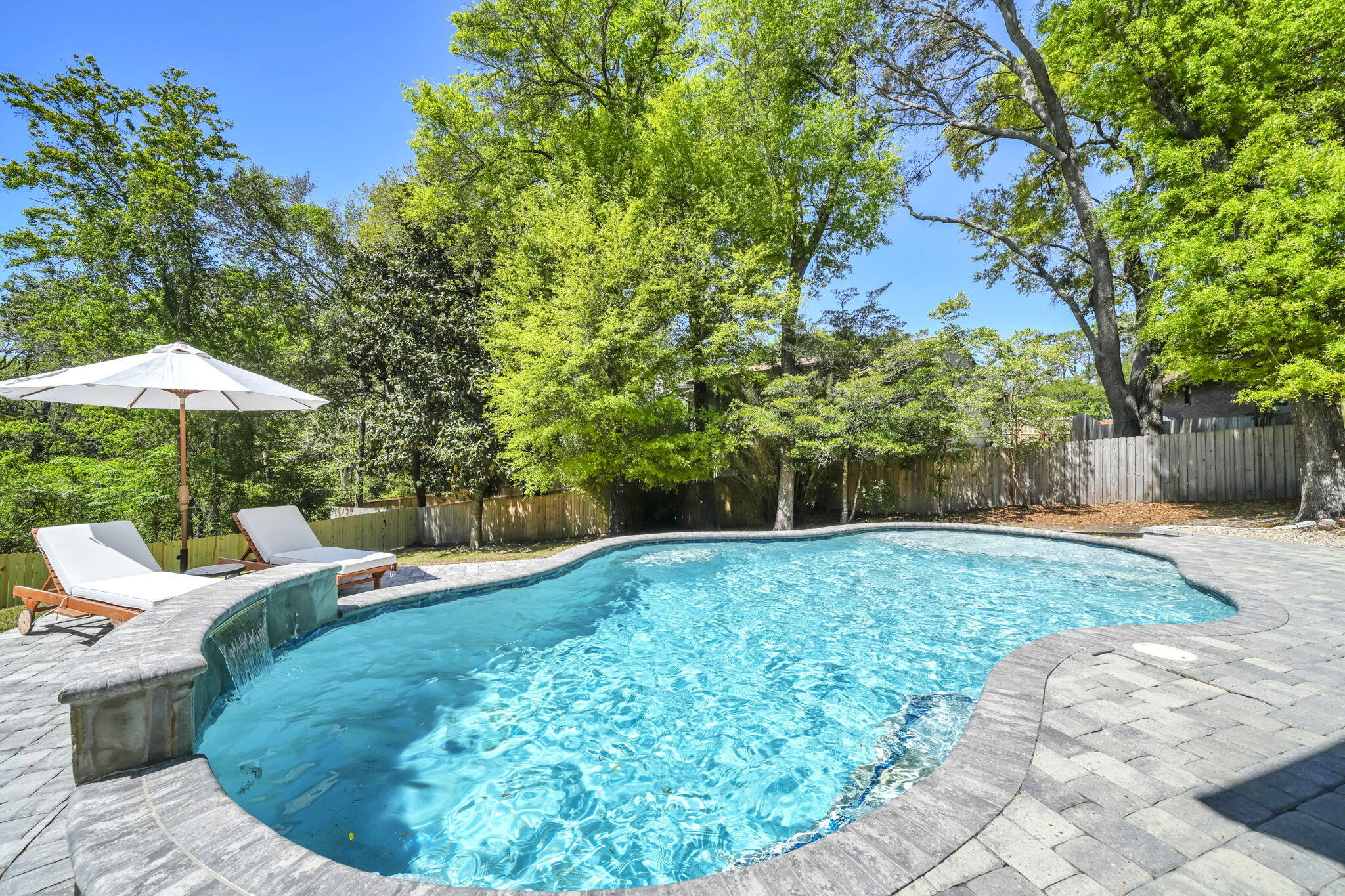 $ 19,100 PRICE IMPROVEMENT ! BREATHTAKING, POOL home tucked in a quiet cul-de-sac with tons of UPDATES in Niceville, FL, Rocky Bayou area. ! Click on the Video. 4 bed, 2 1/2 bath w/ 2 spacious living rooms, dining rooms, loft & screened in porch. .43 of an acre w/ no neighbors in the back, just green space!. Fence 2026, all New Hurricane Impact windows & doors 2020, New Roof with Gutters 2021, Solar Panels 2021 (PAID OFF). Gunite, salt water  Pool with custom paver patio and walkway 2020, New HVAC 2020, New Trex deck 2020, New Water Heater 2020. Remodeled kitchen 2020. Completely remodeled stairwell 2024. New LVP 2020 & upstairs 2023. Remodeled 1/2 bath and UP full bath 2025, both w/ New vanities, plumbing fixtures, flooring & lights. Plus full bath- new bathtub, shower tile & pocket door. New custom molding, fresh paint & new Lighti lighting. Very long driveway for all your family and guest. One of the largest lots in the neighborhood! Minutes away from shopping, parks, restaurants, A+ schools, and the sugar white sand of Destin, FL. Easy commute to Eglin AFB, Duke Field,7th Special Forces & Navy EOD School.