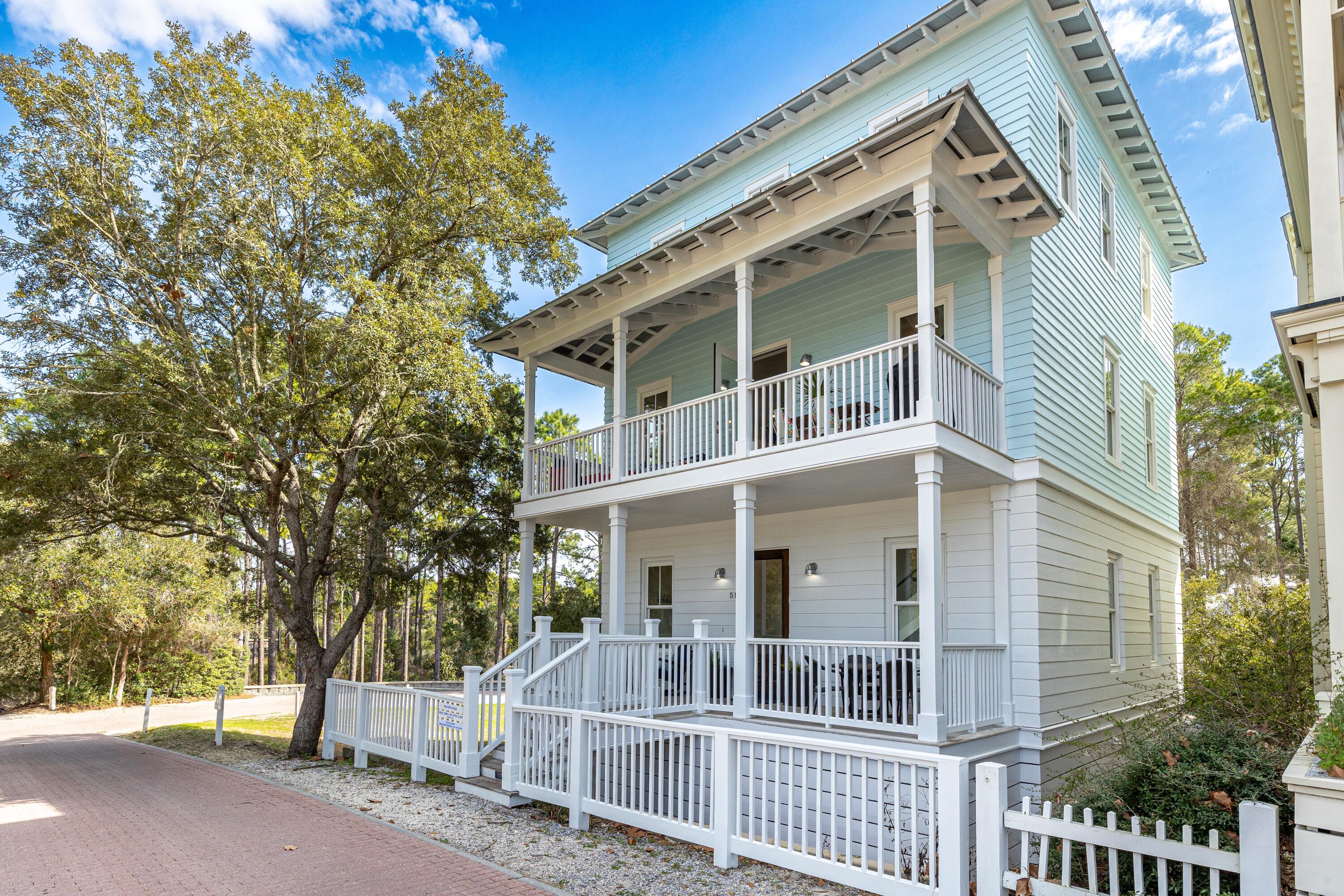 Located in the beautiful town of Seaside, this exceptional coastal home offers rare privacy. Surrounded by open space and sunlight, the property feels like a hidden retreat--yet is less than a five-minute walk to both the beach and the town square.

Recently updated with refined coastal finishes, the home is classified as 5 bedrooms and 5 bathrooms, features 3 king bedrooms, multiple additional sleeping areas, two washer/dryer sets, and comfortably sleeps up to 14 guests.

The first floor includes a lovely spacious entry, a secondary living area great for guests or kids/teens who want their own space, with a triple bunk nook, a queen sleeper sofa, a full bathroom w/ washer and dryer. The 1st floor also includes a king bedroom with an en-suite full bathroom and double vanity. The second floor features an open-concept kitchen, dining area, and family room, along with a king bedroom and shared full bathroom. Step onto the second-story front porch to enjoy views of the tennis and pickleball center, croquet lawn, new fitness facility, outdoor playground with basketball hoop, family pool, and adult pool. 

The second-story porch creates a true indoor/outdoor experience and is a favorite gathering spot that is uniquely special perfect for morning coffee or an evening glass of wine while watching children play on the lawn, neighbors walk their dogs, and the relaxed rhythm of Seaside.

The third floor includes the largest king bedroom with a walk-in closet and private double-vanity bathroom with its own washer and dryer, along with an additional bedroom and a full bathroom off the hallway that also serves the crow's nest level above.

A spiral staircase leads to the crow's nest, featuring a cozy indoor loft with a twin daybed and access to rooftop seating. 

The home offers excellent storage throughout, including ample closets on every level and a full-standing crawl space beneath the entire house. The property is being sold fully furnished and fully equipped, including high-quality, coordinating kitchenware and household items for immediate enjoyment or rental use.

While not rented full time by the current owners, the home has demonstrated strong rental performance during periods it was offered. With rare privacy, flexible sleeping accommodations, walkability, and turnkey furnishings, this property is well suited as a primary residence, second home, or investment opportunity.***Buyer is responsible for personally verifying details about this property.  Any information contained in this listing is believed to be accurate but is not guaranteed.***