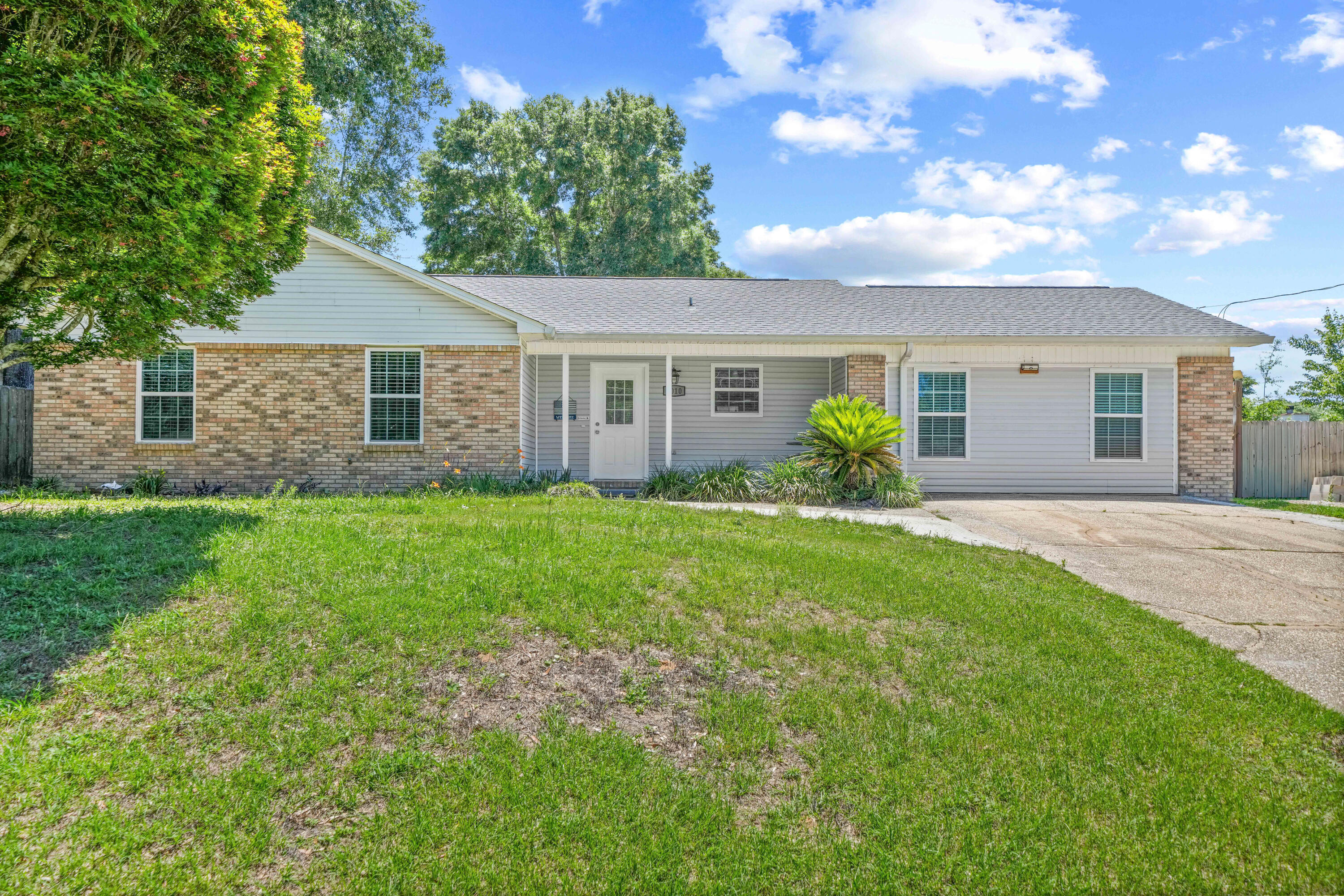 Welcome home to this charming ranch-style retreat nestled in the desirable Kings Crossing subdivision of South Crestview! OFFERING 
This beautifully appointed 3-bedroom, 2-bathroom home with a large bonus room offers the perfect blend of comfort, functionality, and modern upgrades -- all on one level.
Step inside to a spacious living room anchored by a cozy electric fireplace, perfect for relaxing evenings at home. The updated kitchen is a chef's delight, featuring sleek granite countertops, stainless steel Whirlpool appliances, and a gas cooktop ideal for everyday cooking and entertaining alike. 
The outdoor space truly sets this property apart. Double-sided gates on both sides of the home provide easy access to the expansive, fully fenced backyard -- with plenty of room to park your RV, boat, or large trailer. The dedicated 30-amp and 50-amp plug-ins on the back of the shed make powering up a breeze. Unwind or host gatherings under the covered patio, and take advantage of the air-conditioned and heated workshop with electrical hookup -- a dream for hobbyists, woodworkers, or anyone needing a serious workspace. An additional storage shed rounds out the yard perfectly.
Smart upgrades bring incredible long-term value: solar panels paid in full with a 14-year warranty mean dramatically reduced energy costs from day one. Additional highlights include a 2023 roof, 2016 hot water heater, and a Ruud A/C unit (2018). A Bryn pest control termite bond is in place for added peace of mind.
And the convenience doesn't stop there -- the washer, dryer, and a stand-up freezer all convey with the property!
Centrally located in South Crestview with easy access to shopping, dining, and Eglin Air Force Base, this move-in ready gem checks every box. Schedule your private showing today before it's gone!