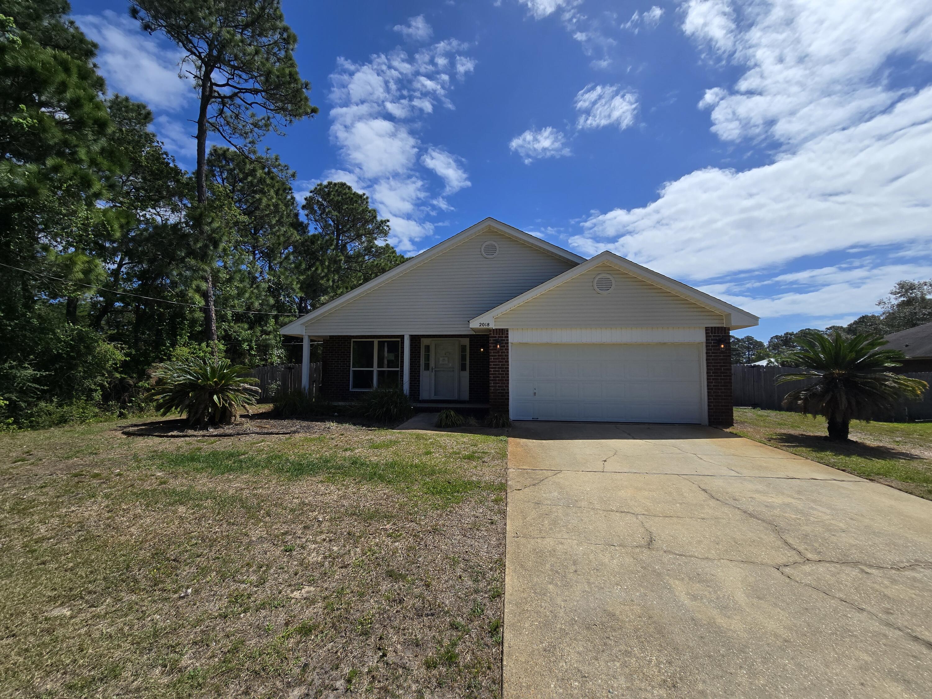 REO- Foreclosed. The perfect blend of style and seclusion in this stunning, move-in-ready 3-bedroom, 2-bath home. Tucked away at the end of a quiet street on nearly half an acre, this property offers privacy and space. The interior boasts an open layout centered around a cozy fireplace, that flows into the kitchen featuring shaker cabinets and quartz countertops. Step outside to a massive, fenced yard where a double-gate side entrance provides the ultimate convenience: dedicated, secure parking for your RV or boat.