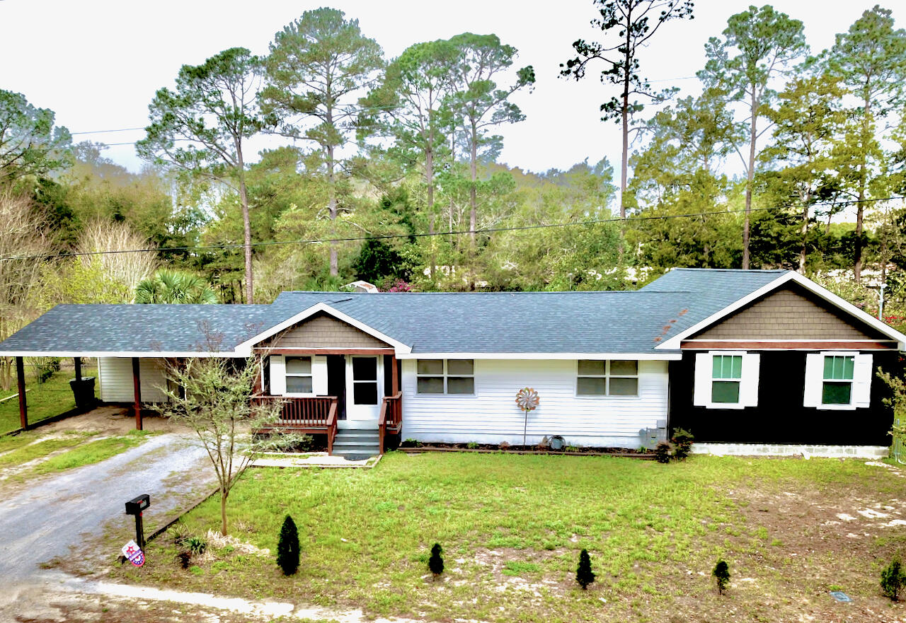 Welcome to 177 Twin Lakes Dr in DeFuniak Springs, where space, versatility, and country living come together on approximately one acre. This 3-bedroom, 2-bath home offers approximately 2,056 square feet of living space with LVP flooring throughout and a floor plan designed for comfortable everyday living.

A spacious addition completed in 2022 added even more room to spread out, including a generous primary suite, an additional bedroom with a large closet, and an expansive second living area. The home also features a dedicated office space, providing the perfect spot for working from home, studying, or managing everyday life.

The main living area is warm and inviting with a gas fireplace, creating a cozy gathering place for family and friends. A tankless gas water heater adds convenience and efficiency.

Outside, you'll find approximately an acre of property with most of the yard enclosed by chain-link fencing, offering plenty of room for outdoor activities, pets, gardening, or simply enjoying your own space. Storage is certainly not lacking--this property includes three storage buildings as well as a climate-controlled storage room, providing exceptional space for tools, hobbies, seasonal décor, and more.

With over 2,000 square feet, multiple living areas, an office, spacious bedrooms and closets, abundant storage, a gas fireplace, and approximately an acre of land, 177 Twin Lakes Dr offers the room and flexibility to truly make it your own. Come experience all this DeFuniak Springs property has to offer!