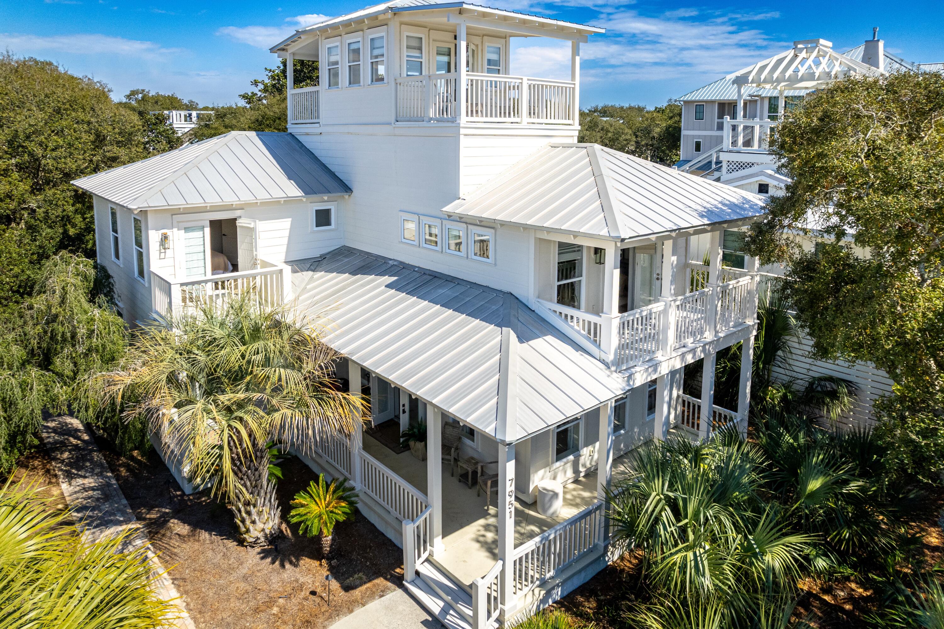 Ideally located on the east end of 30A, this newly renovated coastal retreat sits directly across from Gulf Lakes Public Beach Access and just 0.2 miles from Camp Creek Lake access, offering effortless access for paddleboarding, kayaking and fishing. Enjoy close proximity to WaterSound Beach, Alys Beach and Rosemary Beach, putting some of 30A's most sought-after beaches, dining and shopping just minutes away.

The home has been freshly pressure washed, painted and caulked, with new exterior light fixtures and additional repairs completed this month. Expansive covered porch space spans all three levels, including third-floor balconies with views north over the private heated pool and backyard and south toward the Gulf with Gulf views.

The open-concept first floor features a wet bar with wine refrigerator, ice maker and sink, plus a convenient half bath. The third floor offers a second wet bar with refrigerator and sink, creating an ideal entertaining space.

The fenced backyard features a private pool, lounge area, dining table and grill with a spacious paver patio. A separate fenced side yard provides additional storage. Parking accommodates one vehicle per bedroom, with room to add a garage or potentially a carriage house. The home backs to a non-rental community, providing added privacy and a peaceful setting.

A rare combination of location, outdoor living, Gulf views and flexibility in the heart of 30A.