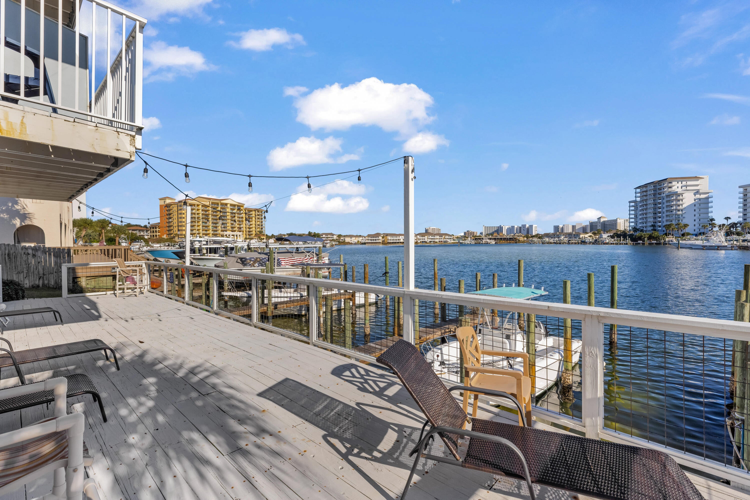 **UNDER APPRAISED VALUE for QUICK SALE** ***BOATERS & BEACHCOMBERS*** Laguna Point is a Destin Harbor Front complex of 16 units with BOAT SLIPS for rent at $75 monthly. If its the beach you want, just a block away is DEEDED BEACH ACCESS to the prettiest beach you've ever seen! COMPLETELY RENOVATED in 2023- including NEW SLIDING GLASS DOORS, FRESHLY PAINTED 12/24, NEW ROOF in 2020, A large garage with plenty of storage + washer/dryer hook-up on the 1st floor with an additional assigned parking spot just outside the front door.  The living / dining / kitchen / half-bath are all on the 2nd floor.  On the 3rd floor are 2 bedrooms / 2 baths each with a walk-in closet.  Unit comes furnished and SHORT TERM RENTALS ALLOWED!!