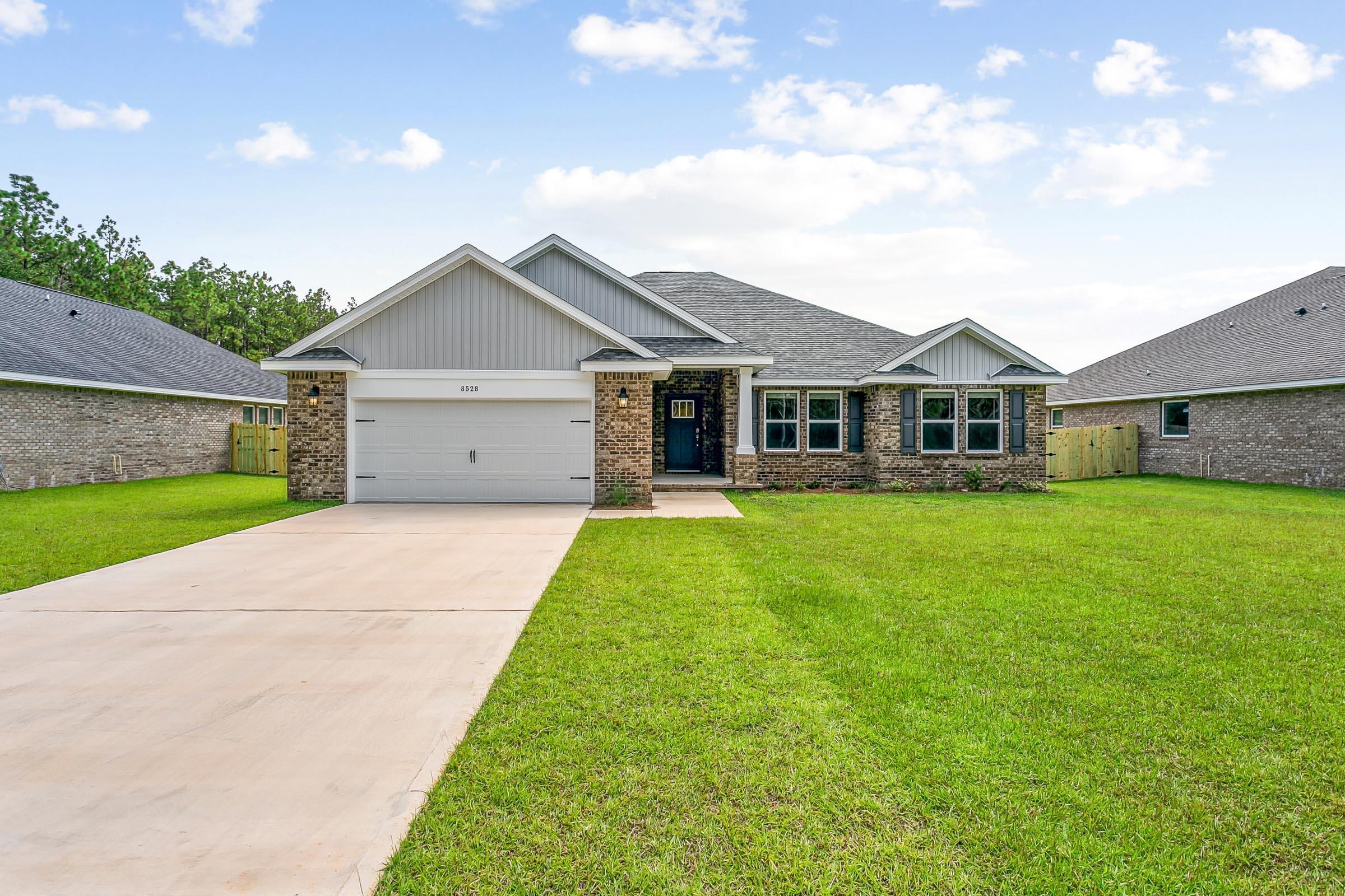 New construction in Buckeyes Landing! The Liberty is a spacious 4-bedroom, 2-bath home featuring an open layout and modern finishes throughout. The kitchen offers stainless steel appliances, granite or quartz countertops, slow-close cabinetry, an island, and a large pantry. The split floor plan provides added privacy, with the primary suite including tray ceilings, double vanities, a tiled walk-in shower, and a garden tub. The fourth bedroom offers flexibility as an office or playroom. Crown molding accents the main living areas, and blinds are included. Buckeyes Landing is ideally situated in the heart of Navarre. The neighborhood is located off Bob Tolbert Road, providing convenient access to major routes including US-98 and State Road 87 for easy commuting east toward Destin or west toward Pensacola. Just minutes from local amenities - including shopping, restaurants, parks, highly rated schools, and world class beaches. Projected completion is February 2027.