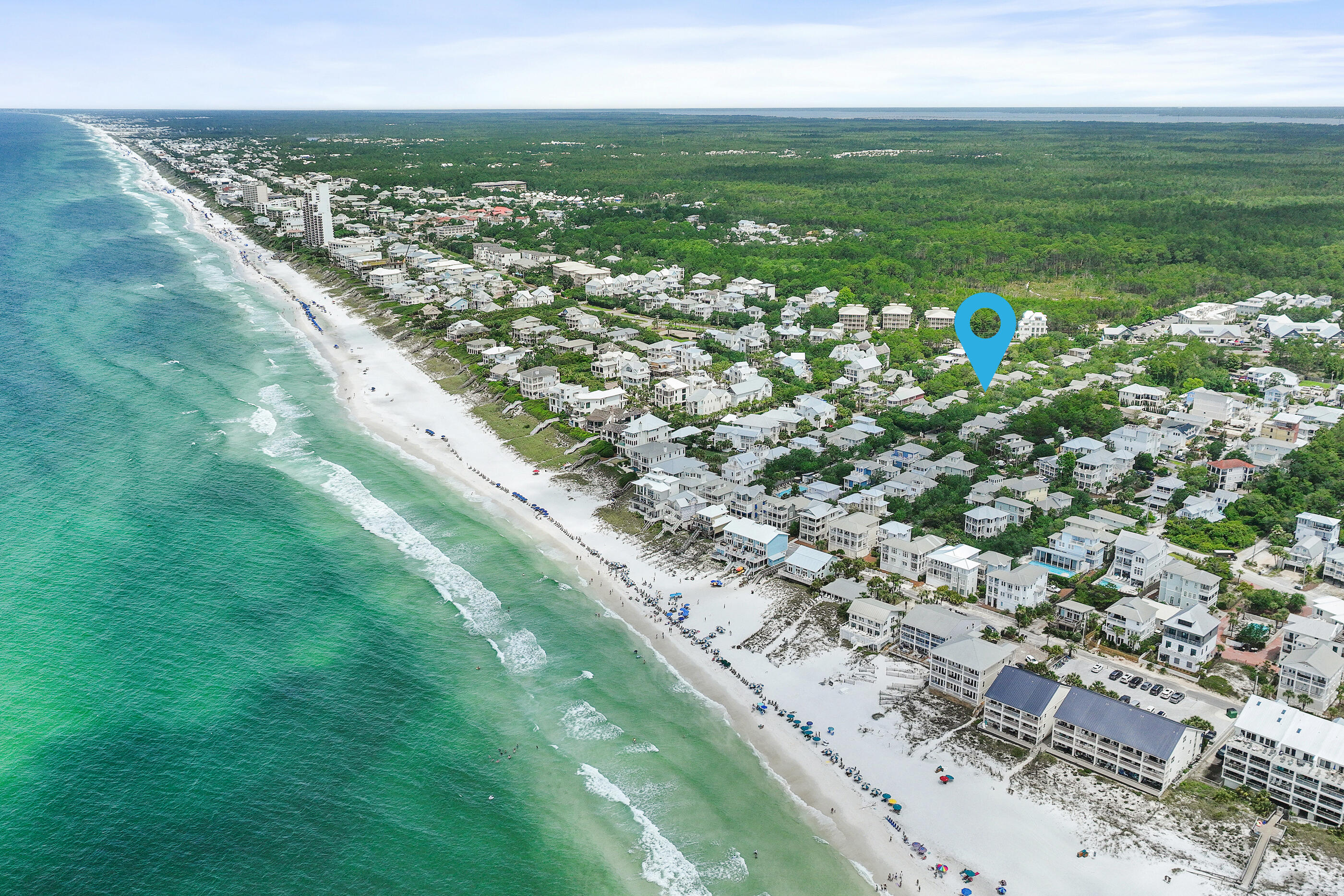 A rare oversized homesite south of 30A, spanning over .22 acres, just steps from the beach, Eastern Lake, scenic natural trails, and the 30A bike path provides the perfect setting for this tastefully renovated coastal retreat in the heart of Seagrove Beach. With no HOA restrictions, the property presents a rare opportunity for true flexibility and expansion. There is ample room to add a luxury resort-style pool, a carriage house, expansive outdoor living spaces, and potential for future vertical development, making it an ideal canvas for a custom 30A beach compound. Tucked beneath a canopy of mature trees on quiet, private street with no through traffic, the setting feels peaceful and secluded while remaining moments from Seaside, Greenway Station, shopping, dining, coffee shops, and local favorites along 30A.The oversized great room flows seamlessly to a screened porch overlooking 50 feet of natural wooded backdrop, extending the living space into a tranquil outdoor setting. The versatile floor plan includes four bedrooms plus a dedicated office that can easily function as a fifth bedroom, making the home well-suited for full-time living, a second home, or a strong investment opportunity. Combining an oversized homesite, ample privacy, walkability, exceptional long-term development potential, this prime location captures the very best of Emerald Coast living in one of Seagrove Beach's most sought-after settings.