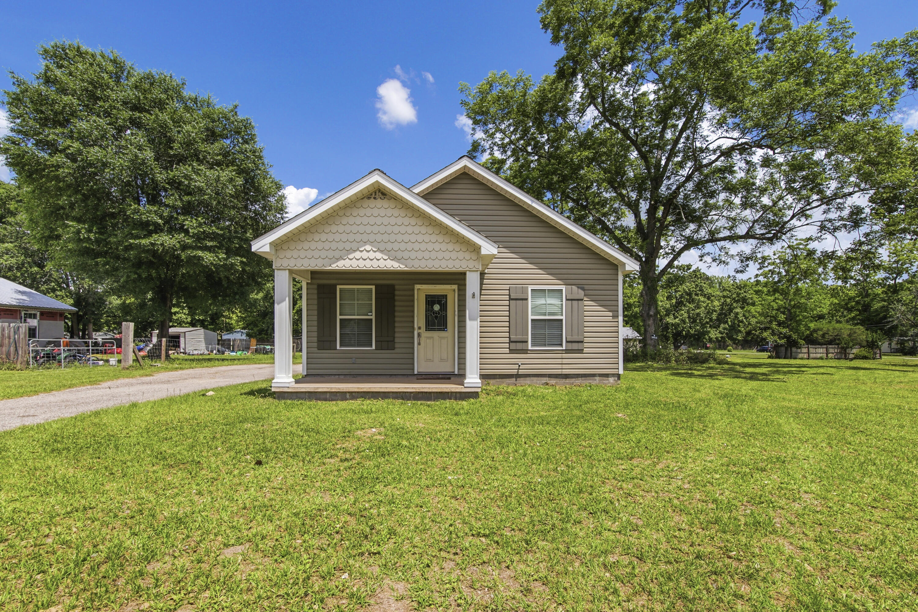 Located in the center of Samson Alabama, this well-built 2016 2BR/1BA home is the perfect starter home or retirement home you are looking for!!!!! Sitting on 0.62 of an acre you have plenty of outside space. Home welcomes you to a large open living room kitchen combo offering you the easy ability to entertain guest with your family and friends. Home has custom cabinets with crown modeling as an extratouch and lots of them to also include a large kitchen bar. The home has a split floor plan with a shared bath, and luxury flooring throughout. Home has a back door that welcomes you to a back porch with an enclosed side laundry room that is perfect for your everyday laundry needs and storage. Seller recently built a 24x24 pole barn on rear of property and includes the cleared lot next to home! Tons of room for a pool, garden, and room to enjoy outside. Call today to view this home!