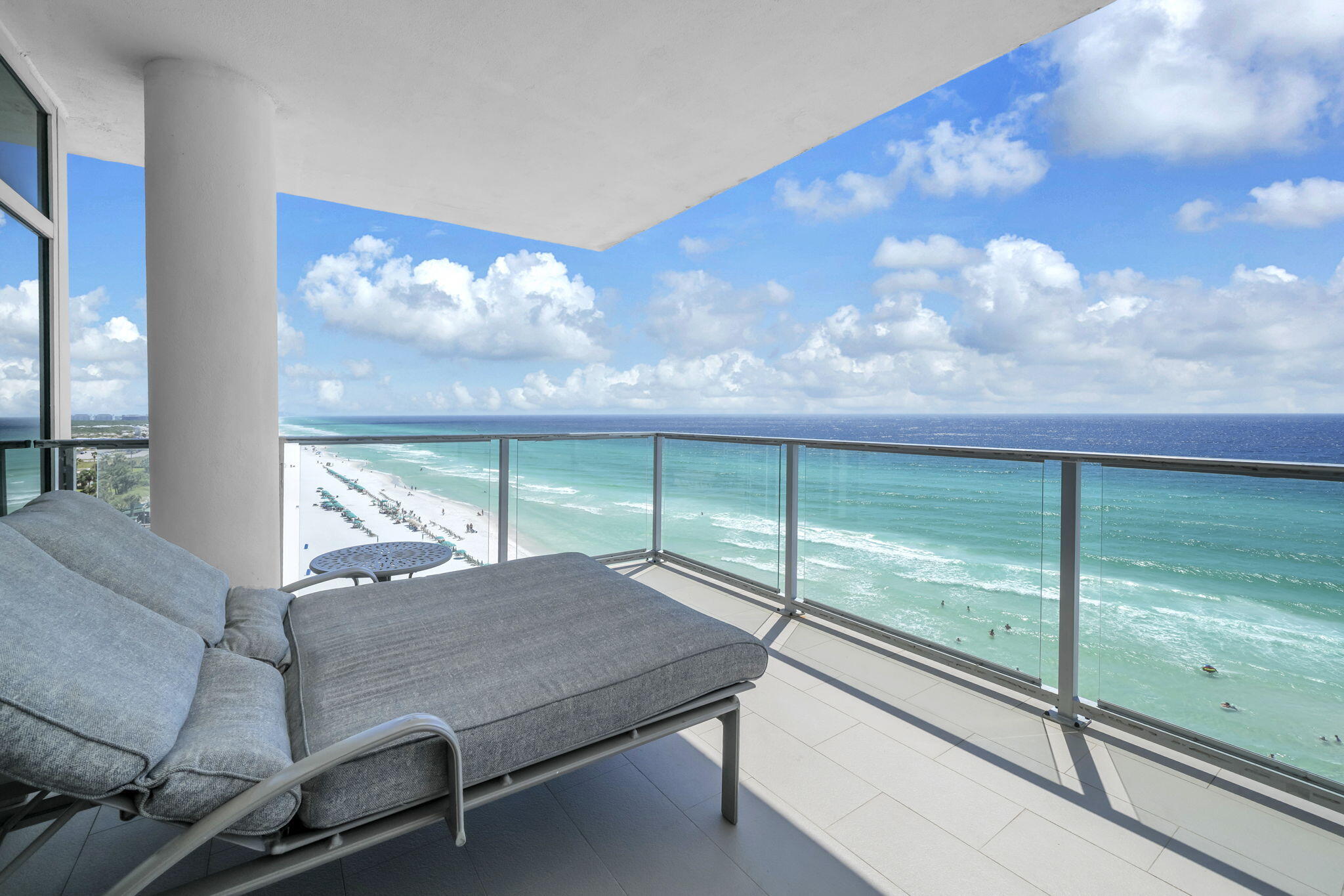 Experience breathtaking 180-degree views of the Gulf of Mexico from this exceptional fully furnished corner-unit condo, located in an exclusive 16-unit luxury building directly on Destin's renowned sugar-white sand beaches and the sparkling Gulf of Mexico. Sweeping Gulf views can be enjoyed from the master bedroom, living area, covered balcony, and second bedroom.

Beautifully designer furnished, this sophisticated retreat offers an impressive combination of style, comfort, and functionality. The spacious interior features neutral oversized tile with small grout lines, wood flooring in the bedrooms, and transoms above the windows that invite an abundance of natural light. The beautifully appointed kitchen boasts custom cabinetry, solid quartz countertops, a solid granite backsplash, stainless steel appliances, and an extra-large refrigerator. Elite lighting, fantastic artwork, an oversized master closet, and thoughtfully selected furnishings add an elevated designer touch throughout.

The luxurious master suite features a beautifully appointed bath with travertine countertops and a stunning marble backsplash behind the soaking tub. The two guest bathrooms are finished with quartz countertops, and every bathroom is equipped with a bidet toilet for an added touch of comfort and convenience.

Resort-style amenities elevate the experience, including a rooftop pool, spa, and fire pit, along with a state-of-the-art fitness center. Private parking underneath the building provides added convenience and security.

Located in an incredible Destin location near The Back Porch and just minutes from the harbor, this condo puts you close to deep-sea fishing, Crab Island adventures, waterfront dining, and all the attractions that make Destin such a sought-after coastal destination.

With its coveted corner-unit position, spectacular 180-degree Gulf views, direct beachfront setting, designer finishes, luxurious bathroom appointments, and exceptional amenities, this is a truly special opportunity to own a luxurious piece of paradise.