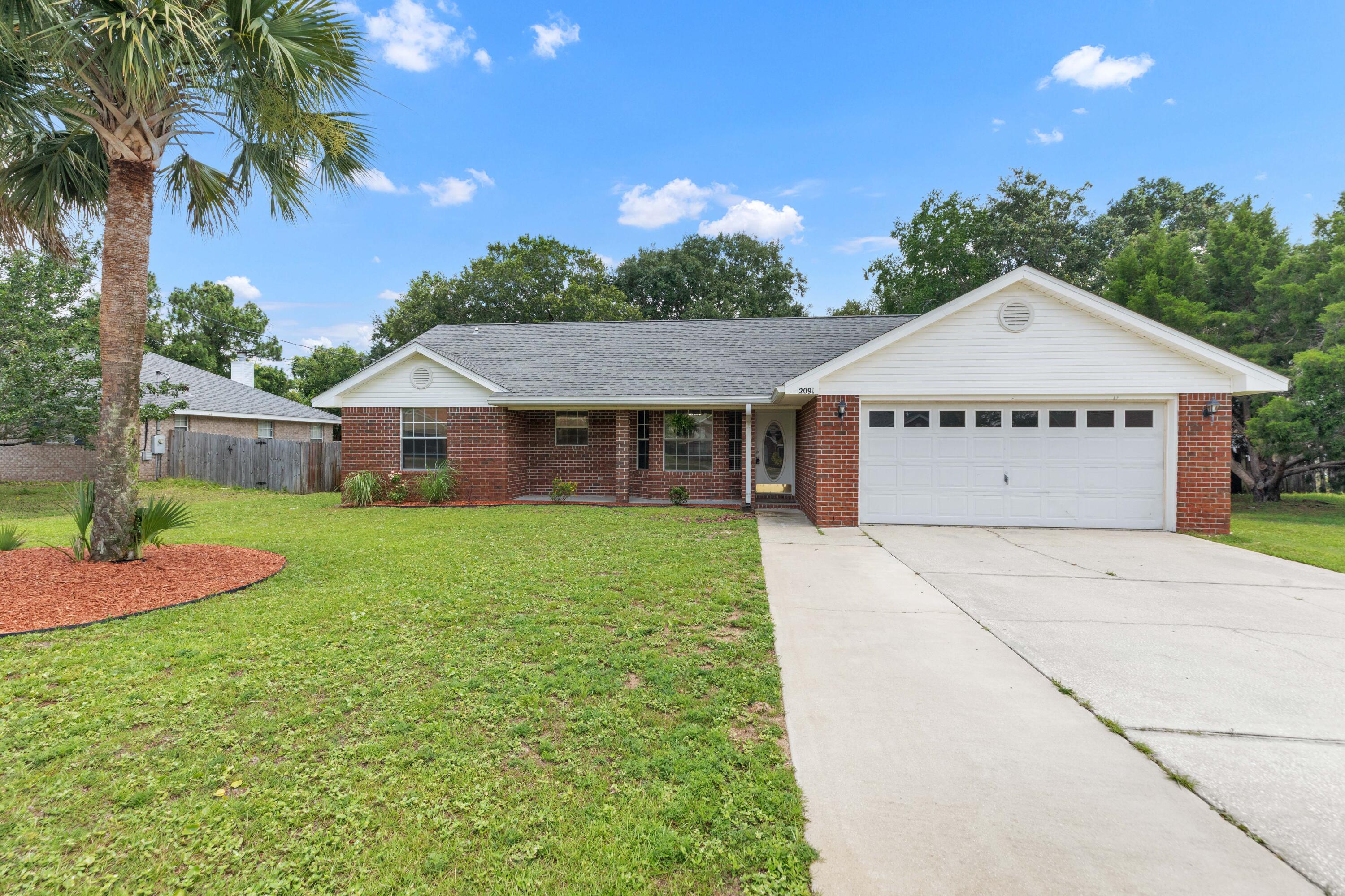 This charming brick home delivers a warm, functional layout highlighted by vaulted ceilings, an open-concept living area, and a split-bedroom floor plan that balances flow with privacy. Sunlight pours into the living and dining areas, creating an inviting space for everyday life. Seller financing is available, offering buyers added flexibility. The kitchen flows seamlessly into the main living space and includes stainless steel appliances, a breakfast bar, and a dining nook framed by a charming bay window. The washer and dryer convey with the sale, adding extra value and convenience. The primary suite offers a peaceful retreat with dual vanities, a garden tub/shower combo, and a generous walk-in closet. Outside, the home sits on a spacious .25-acre lot with a fully fenced backyard, complete with a fire pit for relaxing evenings and a shed for added convenience. The fence also features a gate that opens to allow RV or boat parking right in the backyard. A 2-car garage and an extended driveway, with an additional 5 feet of pavement, provide plenty of parking and storage space. Buyers can also enjoy added peace of mind with major systems already updated: the roof and HVAC are both approximately 5 years old, and the water heater is around 6 years old. Schedule your showing today!
