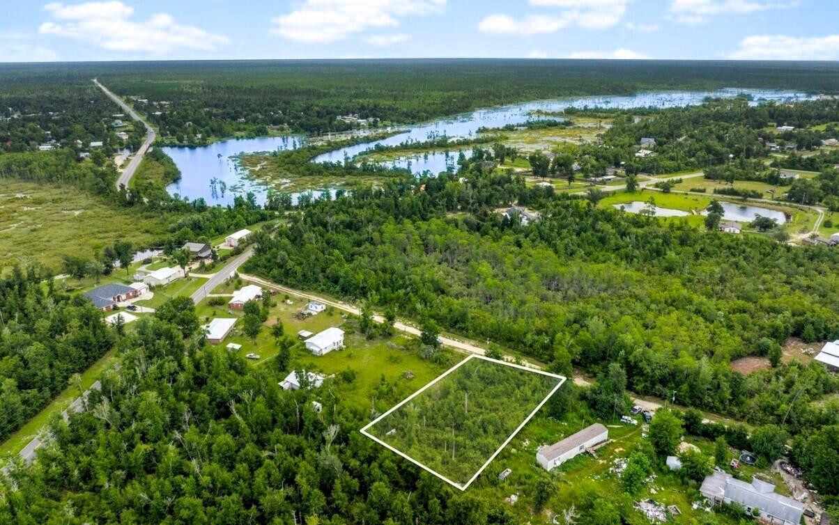 Reasonably priced homesite in sweet area of Deerpoint Lake with nearby access to boat ramps (David Hutchinson and Cedar Creek ramps). No boat? Just run over to Econfina Creek playground of freshwater springs for the kayaker/canoe enthusiast at the rental site or get in at Pitts Springs Park and play area, water on the springs is 68° year-round!  The springs are magnificent and right there.  On this homesite you can build a wonderful starter home, and this area will allow you to place mobile homes on your homesite, so you can begin your home ownership adventure today.  Financing available for qualified buyers.  Give us a call or bring your favorite Realtor now.