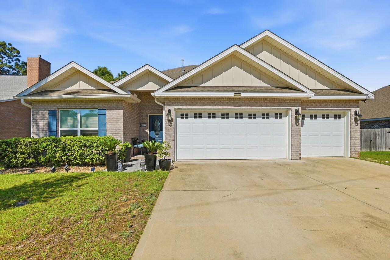 VA Assumable with a 3.25 Interest Rate! Better than New with a Hot Tub for You! One-owner home purchased in 2022, this lovely all-brick craftsman style house sits on an approximate ¼-acre lot in the Patriot Ridge Subdivision, just south of Crestview, Florida. The DR Horton Destin split, and open plan features a huge living-kitchen-dining area, four roomy bedrooms, three full baths, a 12.5x15 back porch, and a 3-car garage. Luxury features were added like trey Ceilings w/crown molding and granite in the kitchen & baths. The kitchen features stainless steel appliances--except for the refrigerator--along with an island and a walk-in pantry.  The primary bedroom suite is a retreat with a big walk-in closet, double vanity, garden tub & large separate shower. Wood-look flooring throughout & Frieze carpet in the bedrooms. The home is equipped with a Smart Home Connect System that includes a video/camera doorbell, keyless entry & more. For your enjoyment, the owners are leaving a hot tub sitting on a newly added deck and protected by a new gazebo. Additional components that make living easier have also been installed, including privacy fencing the backyard, rain gutters on the front and back of the house, an ultraviolet (UV) HVAC system, a water-softening system and conversion of the water heater, furnace, and range to natural gas fuel. Patriot Ridge offers underground utilities, sidewalks, and a nice community pool in a great Crestview location.