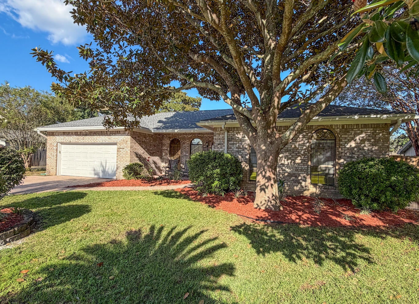 A beautiful paver stone driveway and front porch welcome you to this all brick custom home. Walk in to 10ft ceilings, tall arched windows & a brick fire place.
Bay windows in the dining room allow great views looking out to the patio.
 Stainless steel appliances in the kitchen include a gas stove, and Cafe smart fridge. Built in pot & pan organizers, and under mount cabinet lighting give the kitchen that finial touch.
New LVP flooring in all bedrooms, along with ceiling fans that allow 3 different light and fan modes.
Gorgeous updated shower in the master suite that also enjoys a private entry to the patio.
Relaxation will come easy once you step out to the expansive pool enclosure, and covered porch oasis! There is still plenty of lawn beyond the enclosure, and a mature lemon tree! 
Kell Aire Gardens features 2 nature walk parks. Publix, Target, Beach Access, and Destin schools are all within 5 miles!

Roof, HVAC and hot water heater all replace within the last year!