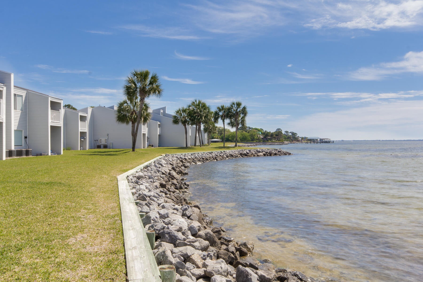 Welcome home to low-maintenance coastal living in this FURNISHED 1st floor condo. Both bedrooms showcase brand new carpet, tile in the main area was professionally cleaned and seller is offering a home warranty for ultimate peace of mind. A gated waterfront community that is also VA approved makes it a great option for those wishing for close access to Eglin AFB.  Resort style amenities including pool, tennis, pickleball, and on-site laundry.  Launch your paddleboard or kayak right from the property and enjoy the beautiful waterfront setting. Convenient to military bases, shopping, dining, and the stunning Emerald Coast beaches. A wonderful primary residence, second home or coastal retreat awaits you. 
Complex is pet friendly and HOA fee includes water, pool, groundskeeping, cable and trash. 
No short term rentals allowed. Assigned parking close to the door.