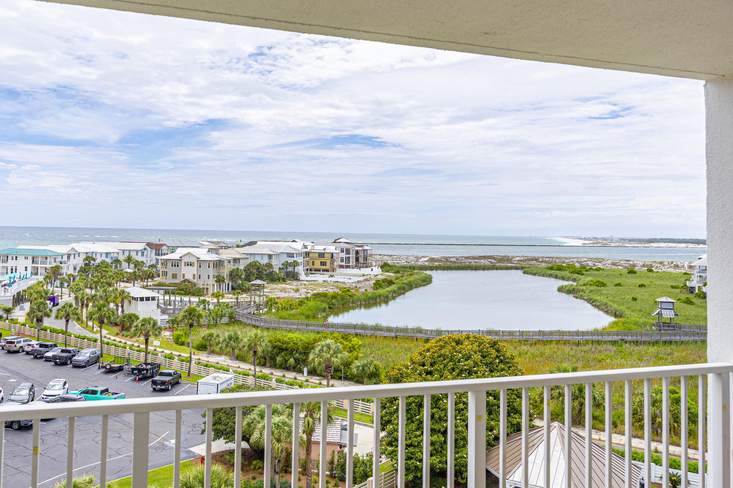 Welcome to Unit 712 at The Islander, a beautifully updated and fully furnished penthouse-level 2-bedroom, 2-bath condo on sought-after Holiday Isle. Perched on the top floor, this spacious residence offers stunning views of the Gulf of Mexico, East Pass, and serene pond, creating the perfect backdrop for coastal living. Recently redecorated and thoughtfully staged, the interior features luxury vinyl flooring, crown molding, and a relaxed coastal aesthetic throughout. The open-concept living and dining area is designed to maximize the views, while the updated kitchen showcases granite countertops, stainless steel appliances, sleek cabinetry, plantation shutters, and a breakfast bar for additional seating.
Step onto the private balcony to enjoy your morning coffee, dine al fresco, or simply take in the breathtaking scenery. The spacious primary suite enjoys direct Gulf views, a dedicated workspace, and an ensuite bath with a separate vanity area and shower/tub combination. A split-bedroom floor plan provides added privacy, with the guest bedroom positioned toward the front of the unit & offering ample space for a king or queen bed. The Islander is one of Destin's most popular resort communities, featuring an expansive deeded beach, lush tropical landscaping, two pools, hot tub, fitness center, tennis, basketball, pickleball, shuffleboard, grilling areas & covered pavilion. Ideally located on Holiday Isle, you're just minutes from Destin Harbor, HarborWalk Village & Crab Island!