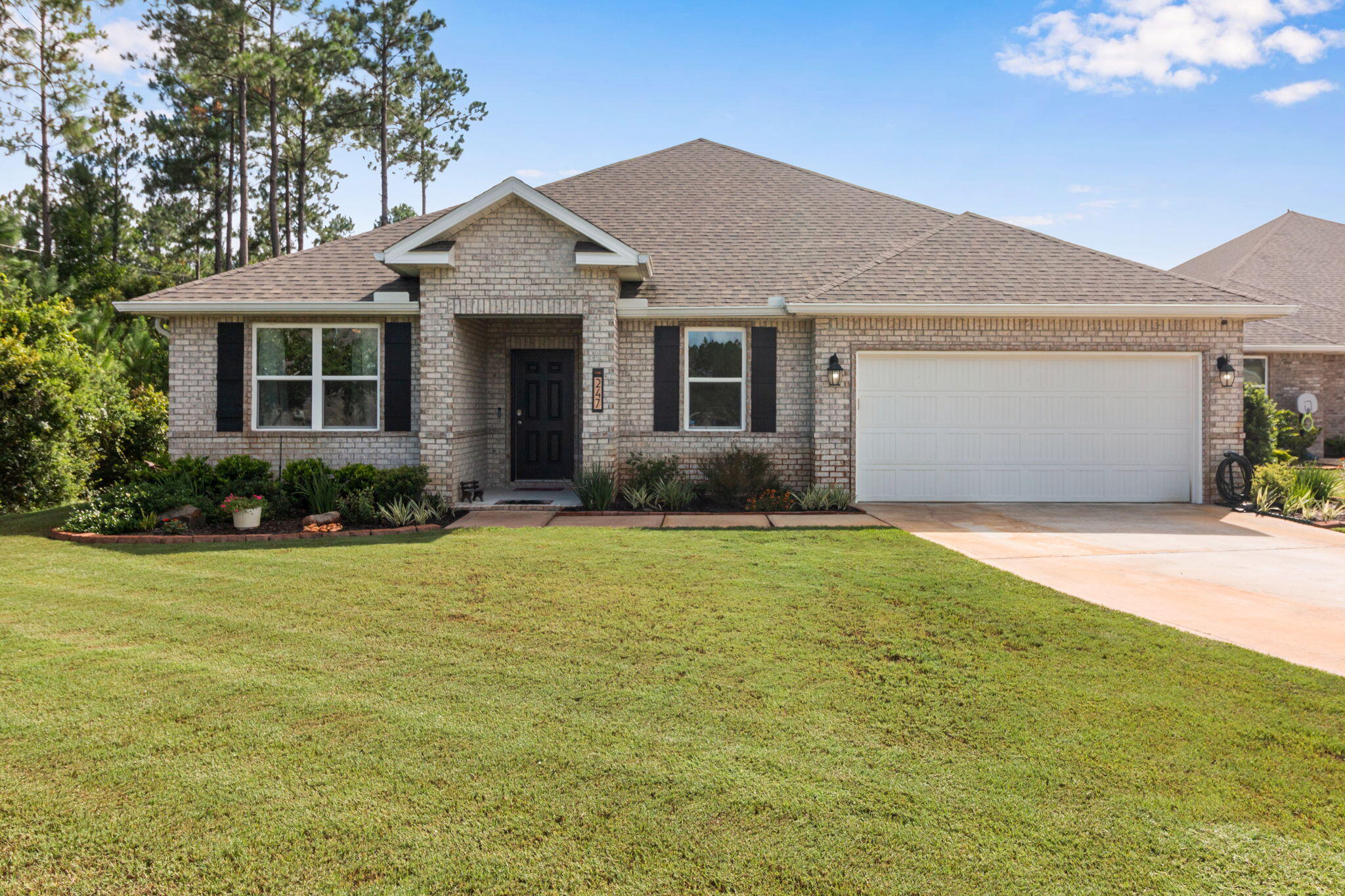 Welcome to this beautifully maintained lakefront home in the highly sought-after Hammock Bay community! Offering 5 bedrooms, 3 full bathrooms, and with a  versatile bonus room, home office, or flex space, this home perfectly blends comfort, style, and functionality.

Designed with an open-concept floor plan, the spacious living, dining, and kitchen areas create an inviting space for entertaining and everyday living. The kitchen features abundant white cabinetry, stainless steel appliances, a large center island with bar seating, generous counter space, and a walk-in pantry. Crown molding, recessed lighting, quartz countertops and luxury vinyl plank flooring throughout the main living areas add timeless appeal.

The private primary suite is a peaceful retreat featuring tray ceilings, dual vanities, a spacious walk-in shower, and an oversized walk-in closet. Four additional guest bedrooms, two full guest bathrooms, and the flexible bonus room provide plenty of space to accommodate family, guests, hobbies, or a growing household.

Enjoy peaceful mornings and relaxing evenings from the screened lanai overlooking the serene lake, offering beautiful water views and a tranquil backdrop. The fully fenced backyard provides plenty of room for pets, play, or simply enjoying the Florida outdoors. Located in the award-winning Hammock Bay community, residents enjoy exceptional amenities including resort-style pools, fitness centers, tennis and pickleball courts, miles of walking and biking trails, parks, playgrounds, sports fields, bayfront amenities, and a vibrant Town Center featuring dining, entertainment, and year-round community events.

Conveniently located just minutes from the white-sand beaches of Scenic Highway 30A, Choctawhatchee Bay, shopping, dining, and top-rated schools, this home offers the perfect combination of peaceful waterfront living and everyday convenience.

Whether you're looking for a spacious family home, room to grow, or simply a place to enjoy the Florida lifestyle, this exceptional lakefront property is ready to welcome you home.