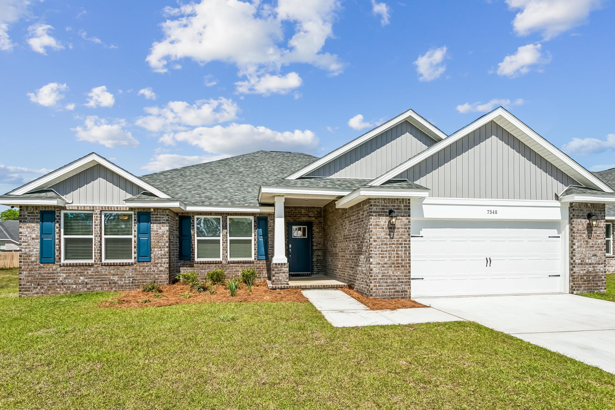 New construction in Buckeyes Landing! The Liberty is a spacious 4-bedroom, 2-bath home featuring an open layout and modern finishes throughout. The kitchen offers stainless steel appliances, granite or quartz countertops, slow-close cabinetry, an island, and a large pantry. The split floor plan provides added privacy, with the primary suite including tray ceilings, double vanities, a tiled walk-in shower, and a garden tub. The fourth bedroom offers flexibility as an office or playroom. Crown molding accents the main living areas, and blinds are included. Buckeyes Landing is ideally situated in the heart of Navarre. The neighborhood is located off Bob Tolbert Road, providing convenient access to major routes including US-98 and State Road 87 for easy commuting east toward Destin or west toward Pensacola. Just minutes from local amenities - including shopping, restaurants, parks, highly rated schools, and world class beaches. Pictures and 3D Tour are of Similar Home Projected completion is November 2026.