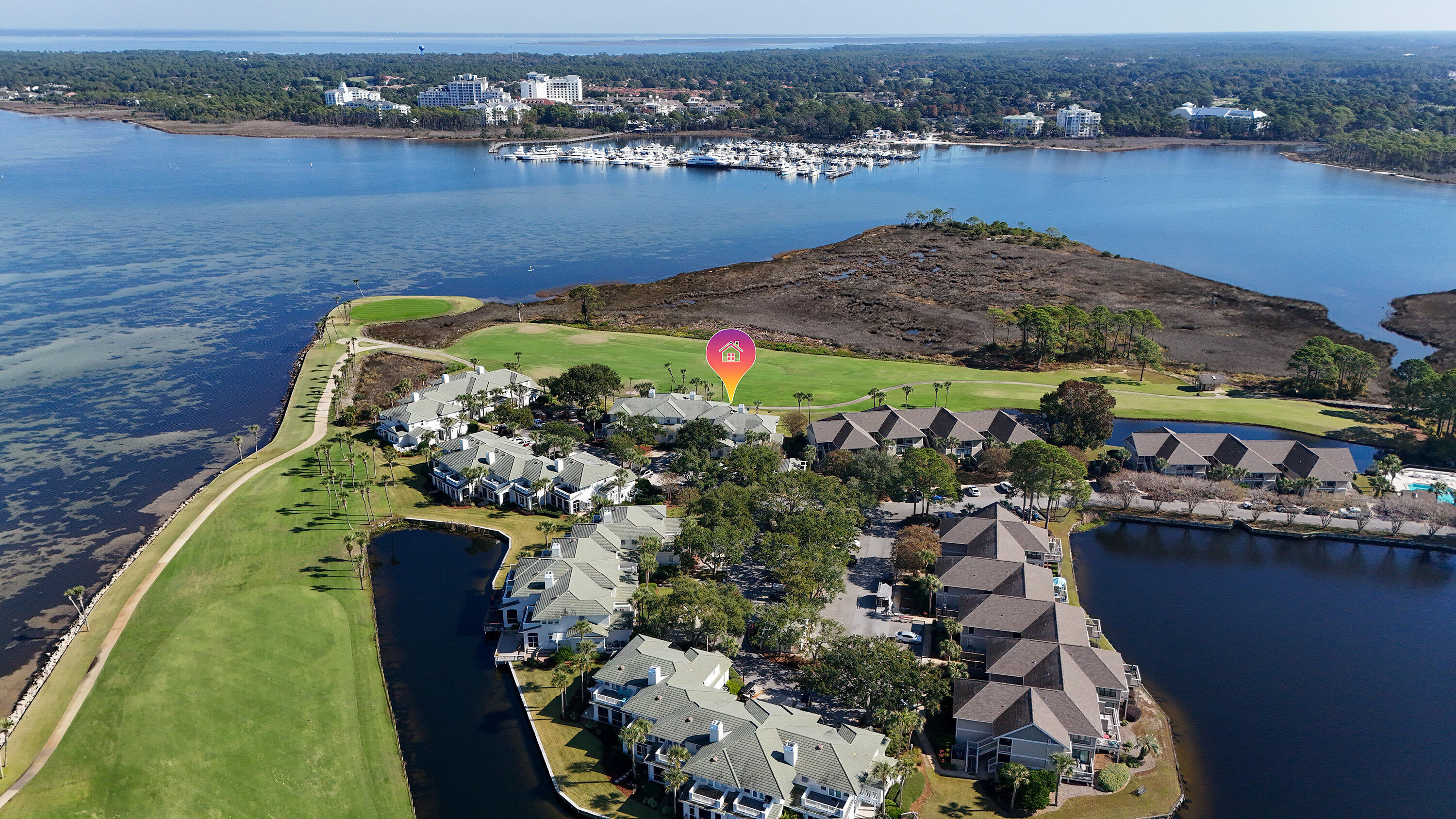 Welcome to an exceptional coastal retreat in the exclusive Grand Harbor neighborhood of Sandestin Golf & Beach Resort, perfectly positioned along the 14th hole of The Links Golf Course with sweeping Choctawhatchee Bay views beyond.
This beautifully situated residence offers a rare blend of tranquil waterfront scenery and championship golf course frontage, creating a setting that feels both private and expansive. Enjoy peaceful mornings watching the light move across the bay and afternoons overlooking manicured fairways from your own backyard sanctuary.
Inside, the home is designed for comfortable coastal living and effortless entertaining, with generous living spaces and an easy flow that complements the surrounding landscape. Whether hosting guests or relaxing after a day at the beach,