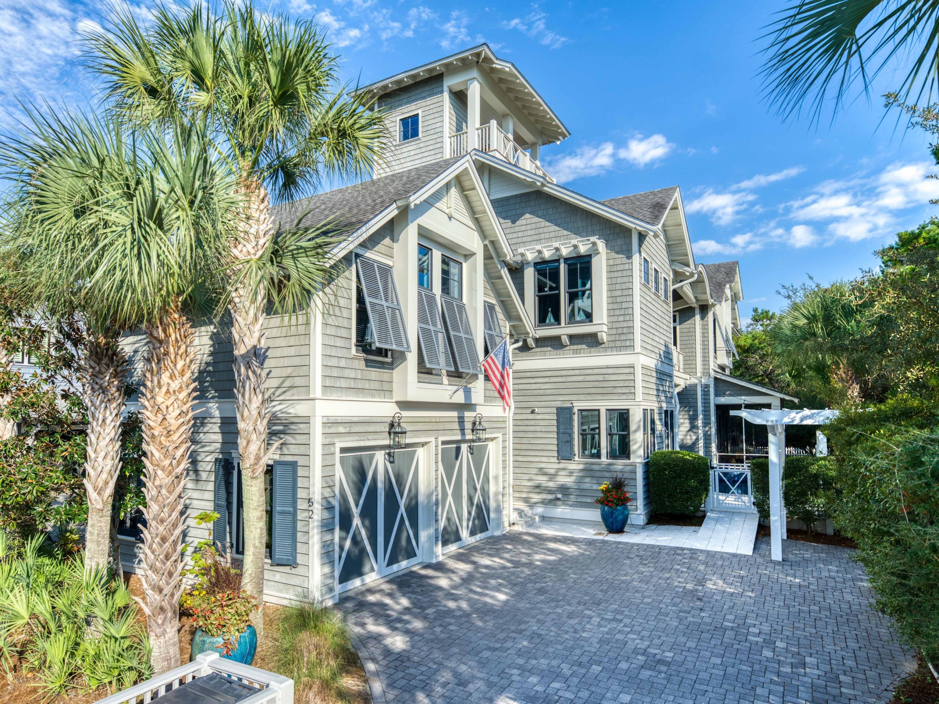 Discover a coastal masterpiece in the exclusive, gated community of Watersound Beach. This stunning, furnished home spans an impressive 4,445 square feet and encompasses five bedrooms, six bed bunkroom, five full baths, one half-bath, two living areas, a two-car garage, a heated pool, and a tower with Gulf views. Seamlessly blending luxury with innovative design, the residence fronts the serene Signal Park green space.
The journey begins on the main level, where an open-concept living area with high, beamed ceilings flows into a chef's kitchen. The kitchen is equipped with a 48'' Wolf dual fuel range, a Sub-Zero refrigerator and freezer, an ice maker, and a beverage fridge.  Both the spacious island adorned with marble countertops and the dining area overlook the pool, while a Also on this floor is a truly unique three-story bunk retreat, which provides access to a loft space, and a full bath. This level also features an oversized guest bedroom over the garage, complete with a sitting area, a full bathroom, and a kitchenette that includes a sink, refrigerator, microwave, and dishwasher. An additional guest bedroom with a full bathroom and a pool-view porch off the spacious hallway complete this level.
The third floor offers a spacious secondary living area which could easily become an additional bedroom. Heading up the stairs is the open-air tower, which provides stunning views of the Gulf and spectacular sunsets.
The gated Watersound Beach community is located south of Scenic Highway 30A, offering homeowners a rare sense of seclusion alongside easy access to area activities. Amenities include swimming pools, a putting park, community green spaces, a state-of-the-art fitness center, and private boardwalks leading to one of the most beautiful stretches of coastline in the area. Embrace unparalleled coastal living- your sanctuary awaits in Watersound Beach!