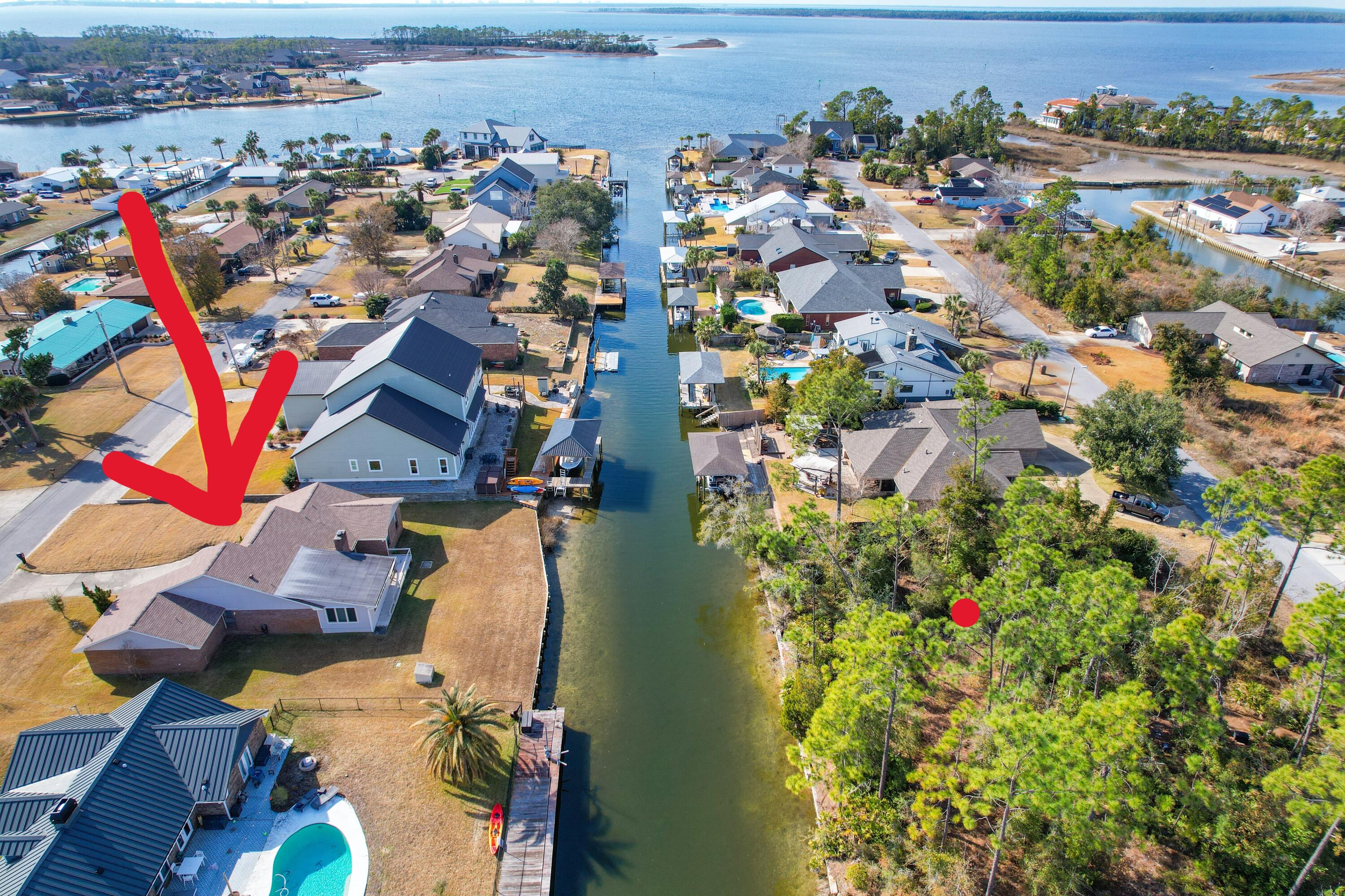 NO HOA and Gulf Access.  Welcome to this one owner 3bedroom 2 bath home, nestled in the golf cart - friendly Northshore area and near the city of Lynn Haven parks, community events and public boat ramps.  With 2185 sq ft of spacious living, this property provides a fantastic opportunity to create your own updates and personalize it to suit your style.  With Gulf access via the canal and North Bay, water lovers could enjoy the convenience of boating right from your backyard.  The large foyer creates a welcoming first impression while the large open family room is perfect for both relaxation and entertaining, featuring skylights, a wet bar and wood burning fireplace.  A separate dining room adds a more formal touch..  The sunroom overlooks the canal