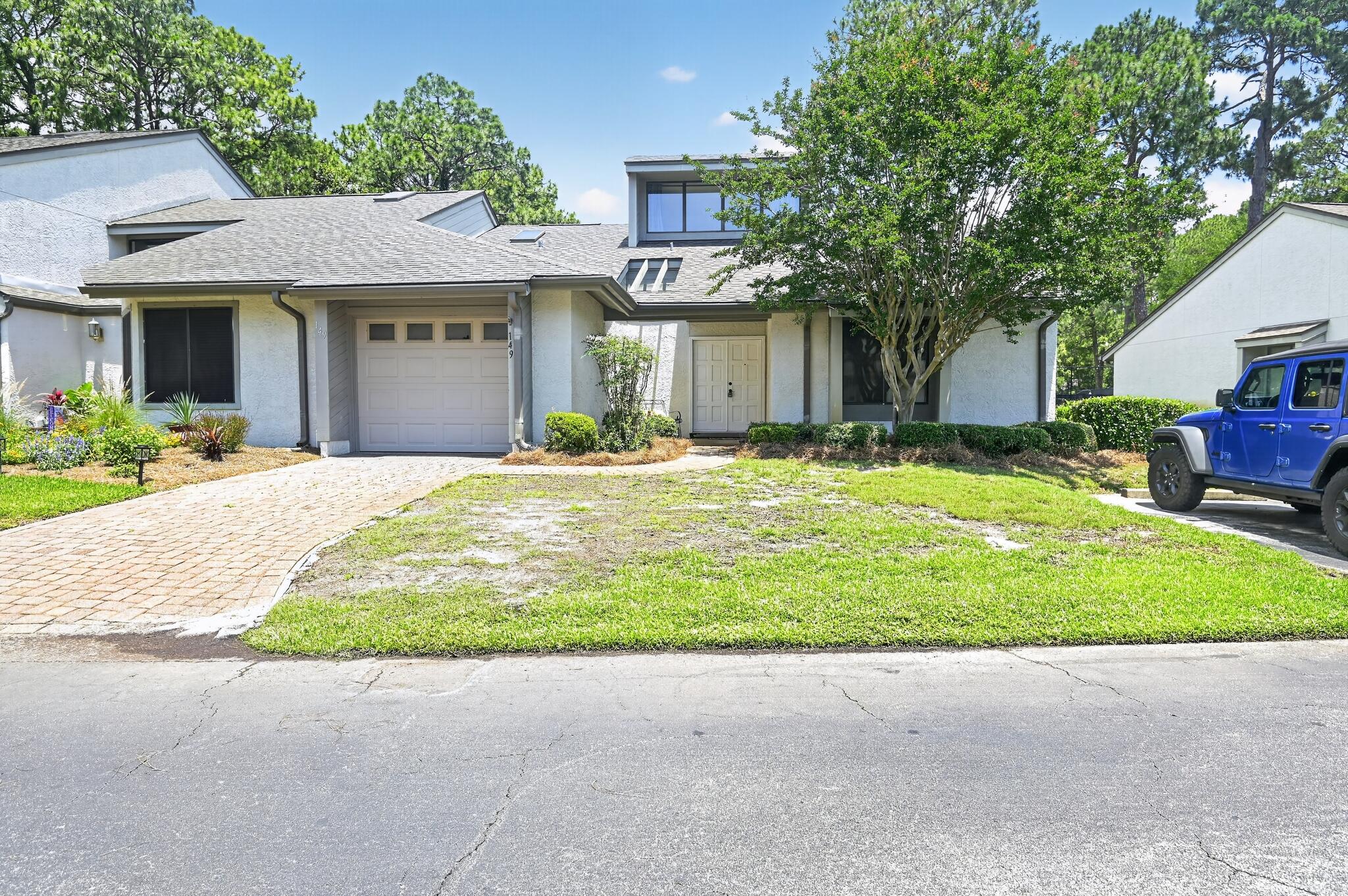 Nestled in the highly desirable, Bluewater Bay community in Niceville, this professionally curated 2-bedroom, 2-bathroom residence seamlessly pairs high-end designer vibes with effortless comfort. Every detail exudes sophistication, from the gorgeous, seamless plank flooring running throughout the entire layout to the architectural elegance of the custom shiplap ceilings. The primary suite serves as a true private sanctuary, featuring a lavish, fully upgraded bath complete with a custom walk-in shower and a large soaking tub. Offering the ultimate indoor-outdoor Florida lifestyle, the home flows beautifully out to a pristine, screened-in back porch--the absolute perfect spot to unwind and relax in total serenity. This turn-key property is also equipped with top-tier functional upgrades, including a newly installed, whole-home water softener and an energy-efficient tankless hot water heater for endless hot water on demand. Beyond your front door, enjoy unrivaled neighborhood amenities just minutes from Destin's famous white-sand beaches, including championship golf courses, a pristine tennis and pickleball center, miles of scenic walking trails, and a full-service bayfront marina.