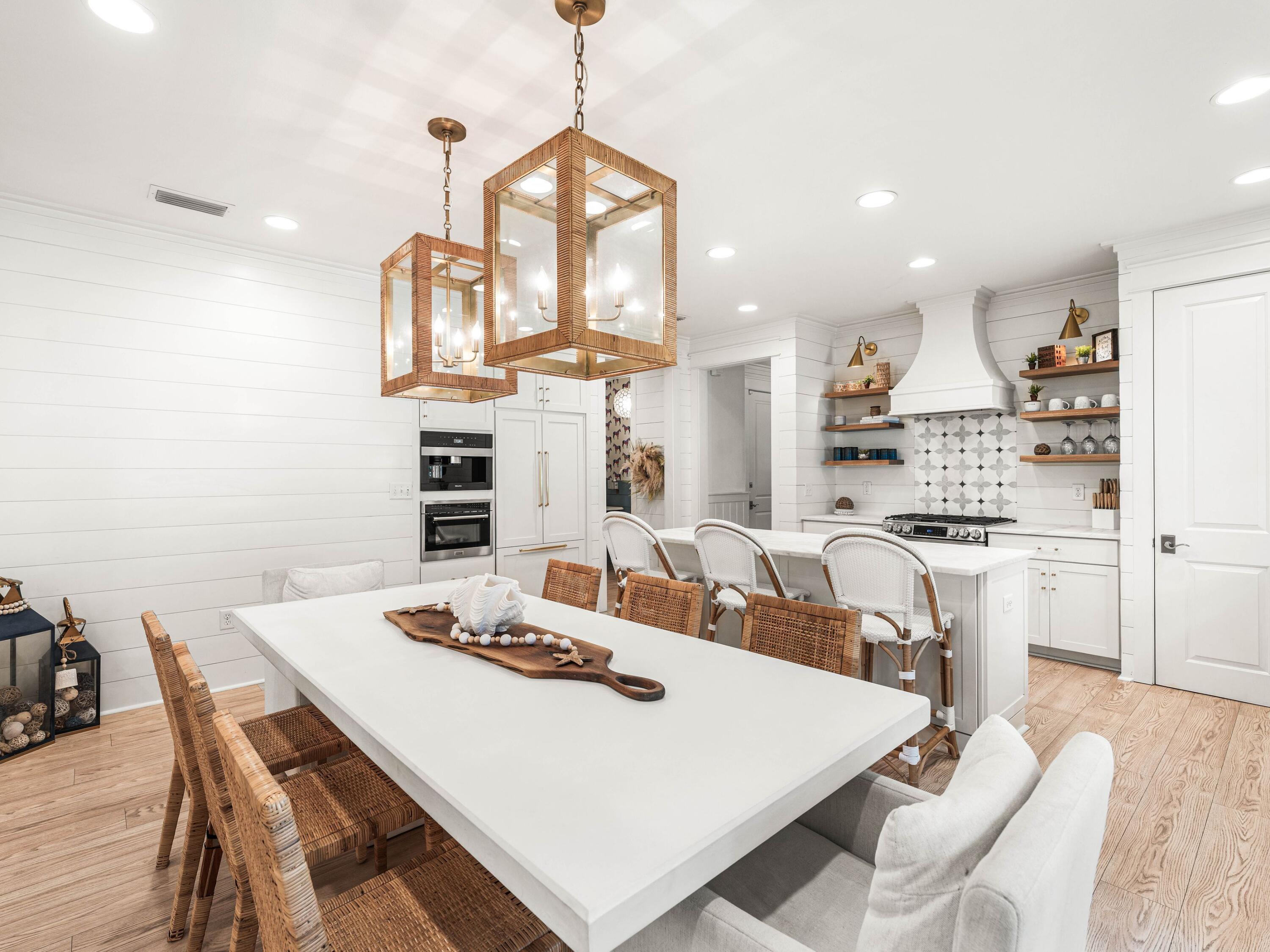 PRICE IMPROVEMENT! Come view this comprehensive transformation that must be seen, featuring exceptional finishes and features! The location offers genuine privacy, complemented by a mature tree canopy that provides natural shade and picturesque streetscape. The interior is a testament to modern luxury, showcasing premium upgrades in the kitchen, including custom cabinet panels, a Dolomite counter island, a built-in Miele coffee bar, an ice maker, a marble backsplash, and white oak shelving. Shiplap walls encircle the dining and kitchen areas.
The spacious living room is bathed in natural light, enhanced by Serena & Lily lighting. The floor plan is thoughtfully arranged, featuring a spacious primary suite with an ensuite bathroom and a guest bedroom with a full bathroom on the main level. Two additional large bedrooms are located upstairs, one with custom-built-in bunks and the other with queen trundle beds. These bedrooms share a renovated bath with designer tile and a vintage cast iron double sink. The layout is ideal for either a primary residence or a vacation home, providing ample space for relaxation or entertaining.
Additional special features of the residence include whitewashed floors, custom window treatments, a new HVAC system, updated bathrooms, and California Closets throughout. The efficient built-in laundry and custom cabinetry for beach or school drop-off complete a renovation that prioritized functionality as much as aesthetics. The screened patio offers year-round enjoyment, while the fenced yard extends the living space outward and a neighborhood green space is located across the street.

Watersound Origins offers residents the perfect combination of natural beauty and modern amenities. Surrounded by towering pines and Lake Powell, the community is only two miles from the vibrant beaches of Scenic Highway 30A. The Village Commons serves as the neighborhood hub, featuring a resort-style pool, fitness center, playground, pickleball and tennis courts, and an event lawn. Residents enjoy access to the highly rated Origins Golf Course, scenic walking and biking trails, Lake Powell access, and the upcoming Art Park. Additionally, the Watersound Town Center at the entrance to the community offers dining, shopping, a Publix grocery store, medical facilities, and more.