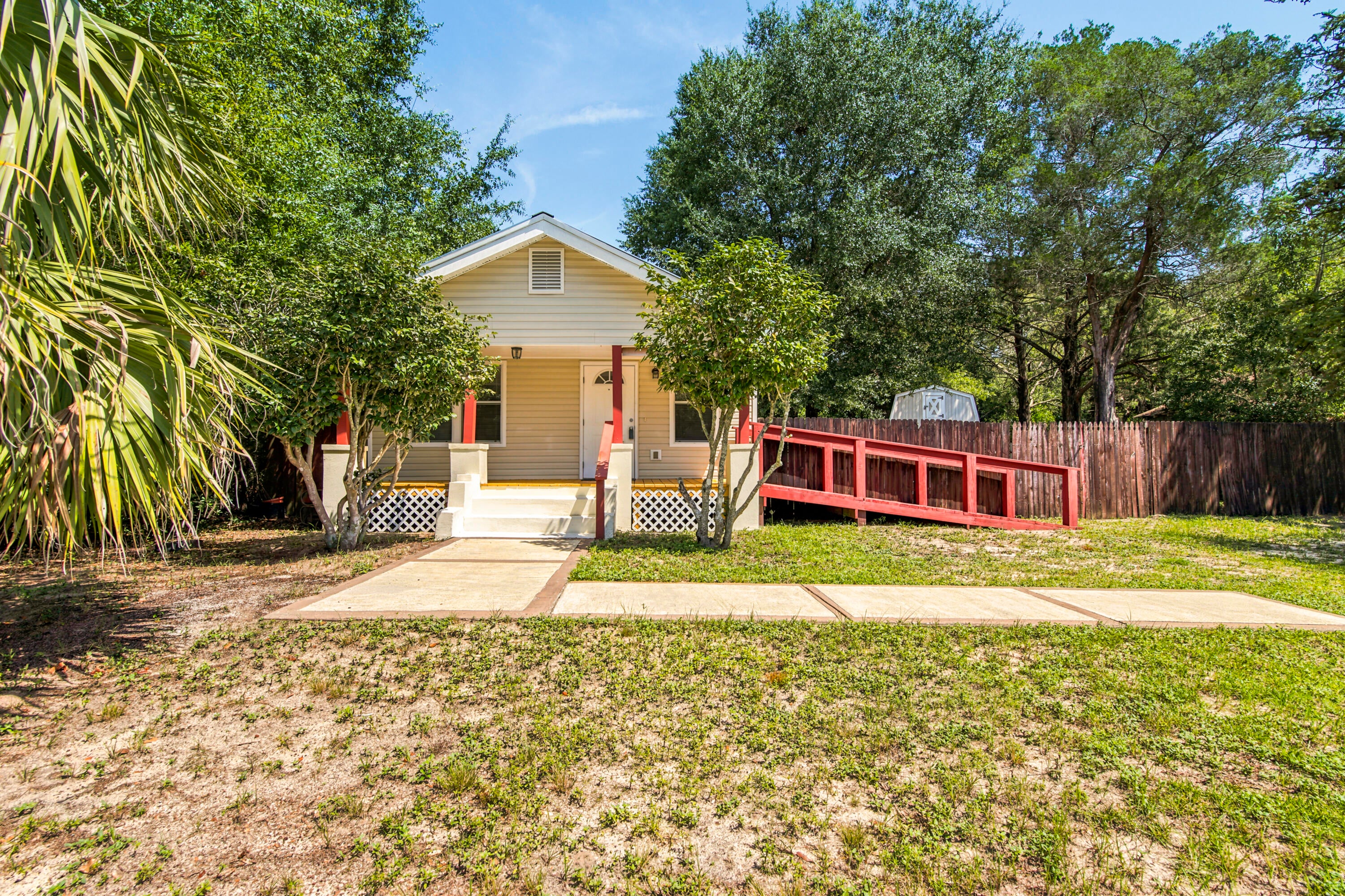 Looking for affordable value without compromising comfort? Fully renovated in 2017, this home delivers three bedrooms, two baths, and roughly 1,267 square feet of easy living--all at a price point that's tough to beat. Tile flooring flows throughout, with cozy carpet reserved for the bedrooms, while a large utility room keeps everyday clutter tidy. Open covered porches front and back invite morning coffee or evening unwinding, and three yard buildings handle storage with ease. Enjoy genuine privacy just minutes from town, plus wheelchair-accessible convenience. Whether you're starting out or building an investment portfolio, this charmer checks the boxes. Come see for yourself!