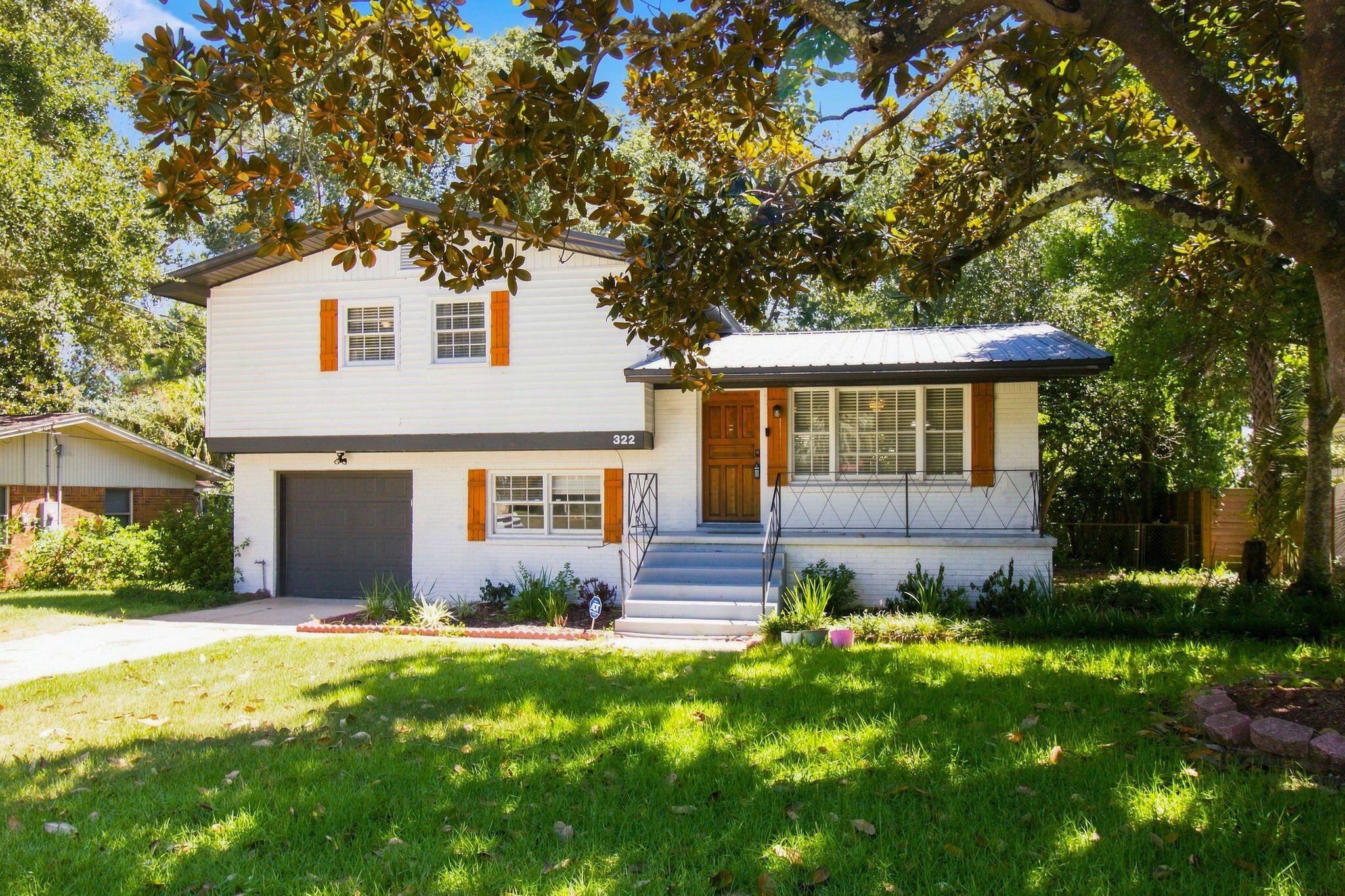 A Mid-Century Classic with Serious Potential in One of Fort Walton Beach's Most Desirable Locations

If you love homes with character and can recognize an opportunity when you see one, this classic mid-century split-level deserves your attention. Beautifully updated, filled with personality, and situated on a lovely lot beneath mature hardwoods, this is not another cookie-cutter house- and the price reflects an opportunity for a buyer willing and able to address known environmental and airflow concerns.

The welcoming main level features an open living, dining and kitchen area with abundant natural light. The beautifully remodeled kitchen keeps the design clean and timeless with white cabinetry and woodwork, gorgeous white quartz countertops, a deep farmhouse sink and stainless steel appliances. Updates include LVP flooring, interior doors and hardware, fully updated electrical wiring, and most recently, all-new modern, double-pane, hurricane-rated windows.

Upstairs you'll find three bedrooms with wonderful treetop views and two full bathrooms. Downstairs may be the coolest part of the house: a large, flexible bonus space that could become a fourth bedroom, home theater, game room, gym, office or combination of uses. The laundry area is also located on this level.

Outside, mature shade trees create the a wonderful backyard retreat with an open patio, separate porch and storage building.

The property does have a known biological growth/mold condition, including visible growth in multiple areas of the home. The sellers previously completed remediation following a downstairs water leak. More recently, the home has been evaluated by a general contractor, HVAC airflow specialist and mold remediation professional regarding current conditions. Observations include negative-pressure/airflow concerns on the upper level, inadequate upstairs return-air circulation, insufficient insulation and outside humid air entering through penetration points, contributing to condensation and biological growth.

The sellers have PCS'd and have elected to price the property to reflect its current condition rather than undertake additional remediation and building-envelope/HVAC improvements themselves.

For the buyer with the resources and ability to take on the needed work, this represents an unusual opportunity to own a truly distinctive Fort Walton Beach home at a price that recognizes the work ahead. The architecture is fantastic. The major cosmetic transformation has already been done. The electrical has been updated. The windows are new. What remains is an opportunity for the next owner to address the home's environmental and airflow issues properly and complete the transformation.

Bring your contractor, bring your vision, and take a serious look at the potential here. Property is being sold in its current condition with known biological growth/mold and related airflow/building-envelope concerns. Buyers are encouraged to perform all inspections and obtain independent professional evaluations appropriate to their needs.